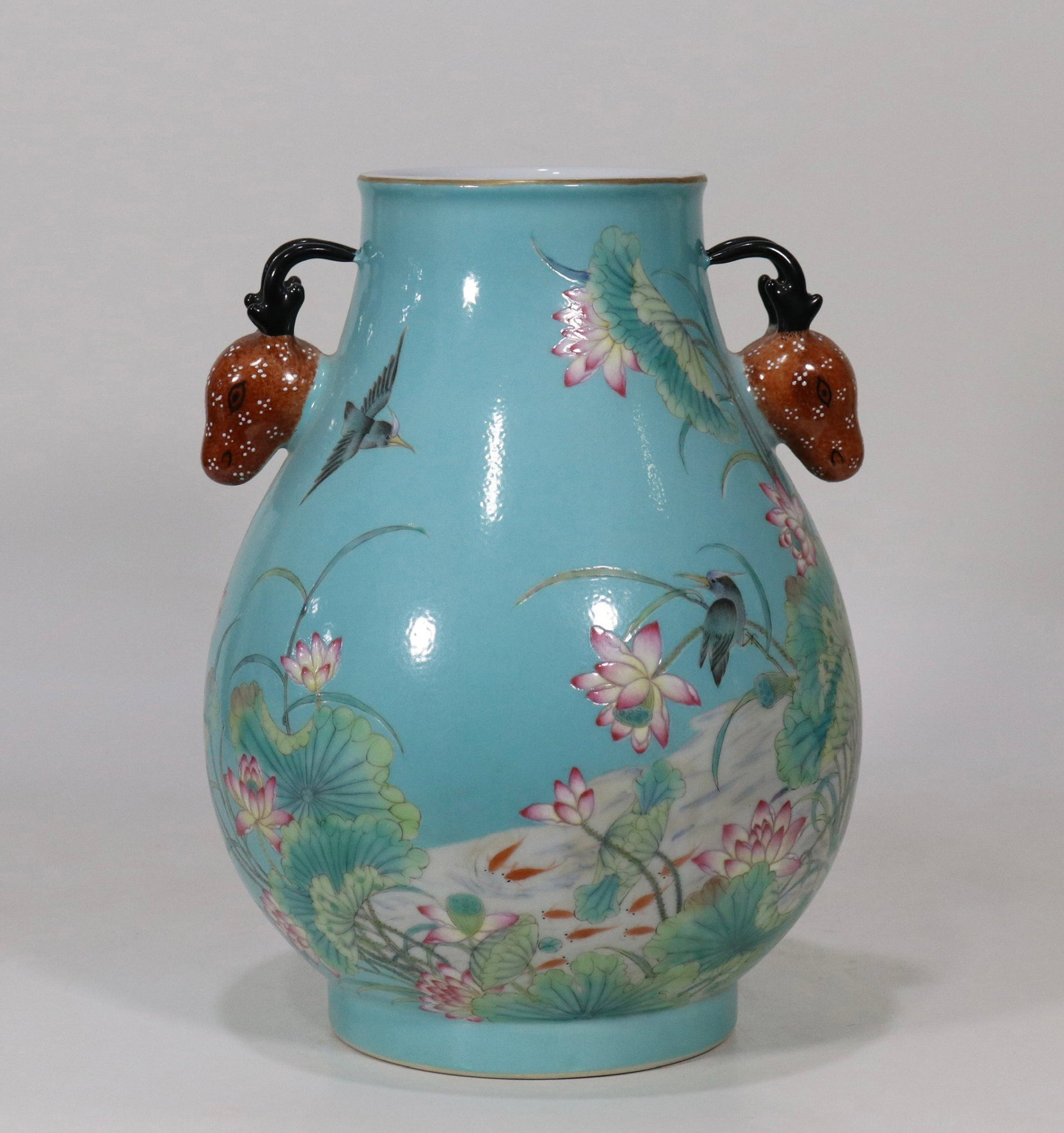 A fine turquoise green ground famille rose deer-head zun vase with lotus pond and bird pattern: A fine turquoise green ground famille rose deer-head zun vase with lotus pond and bird pattern, Qing Dynasty, China, with six-character Qianlong reign mark, Size:10.7in 松石绿地