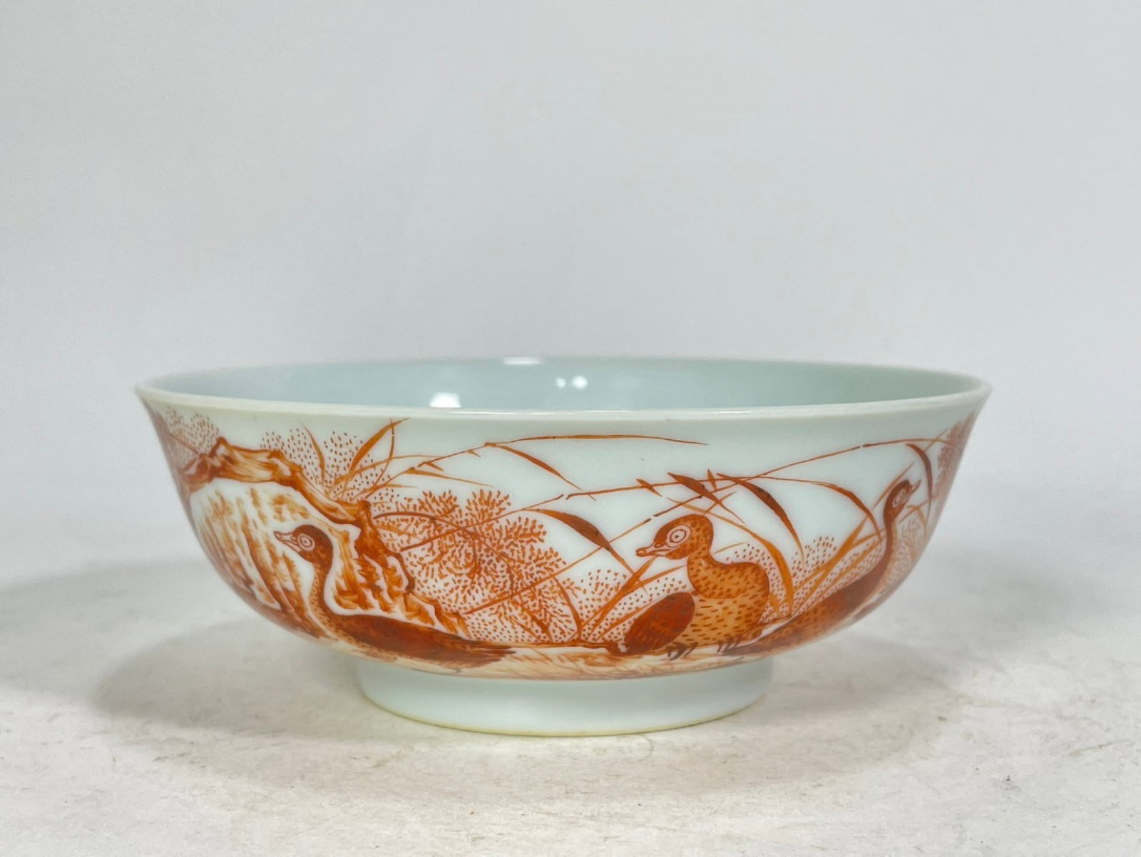 An Exquisite Iron-Red Reed Goose Pattern Bowl,with poem: An Exquisite Iron-Red Reed Goose Pattern Bowl,with poem,Qing Dynasty,China,Yongzheng Six-character Mark,Size:1.8inx4.8in 矾红芦雁纹碗,带诗文,È