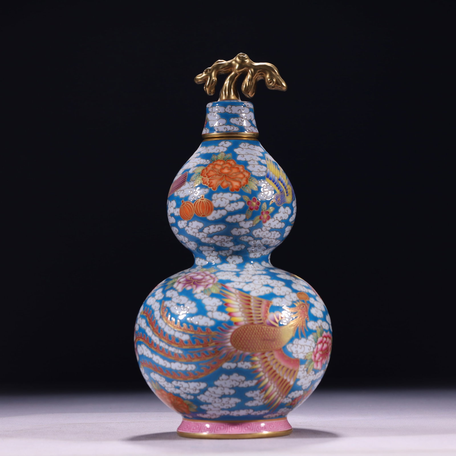 An Exquisite Blue Ground Famille-Rose Painted Gold Auspicious Cloud and Phoenix Pattern Gourd-Shaped: An Exquisite Blue Ground Famille-Rose Painted Gold Auspicious Cloud and Phoenix Pattern Gourd-Shaped Vase,Qing Dynasty,China,Qianlong Four-character Mark,Size:4.7inx10.2in,Weight:850g 蓝地