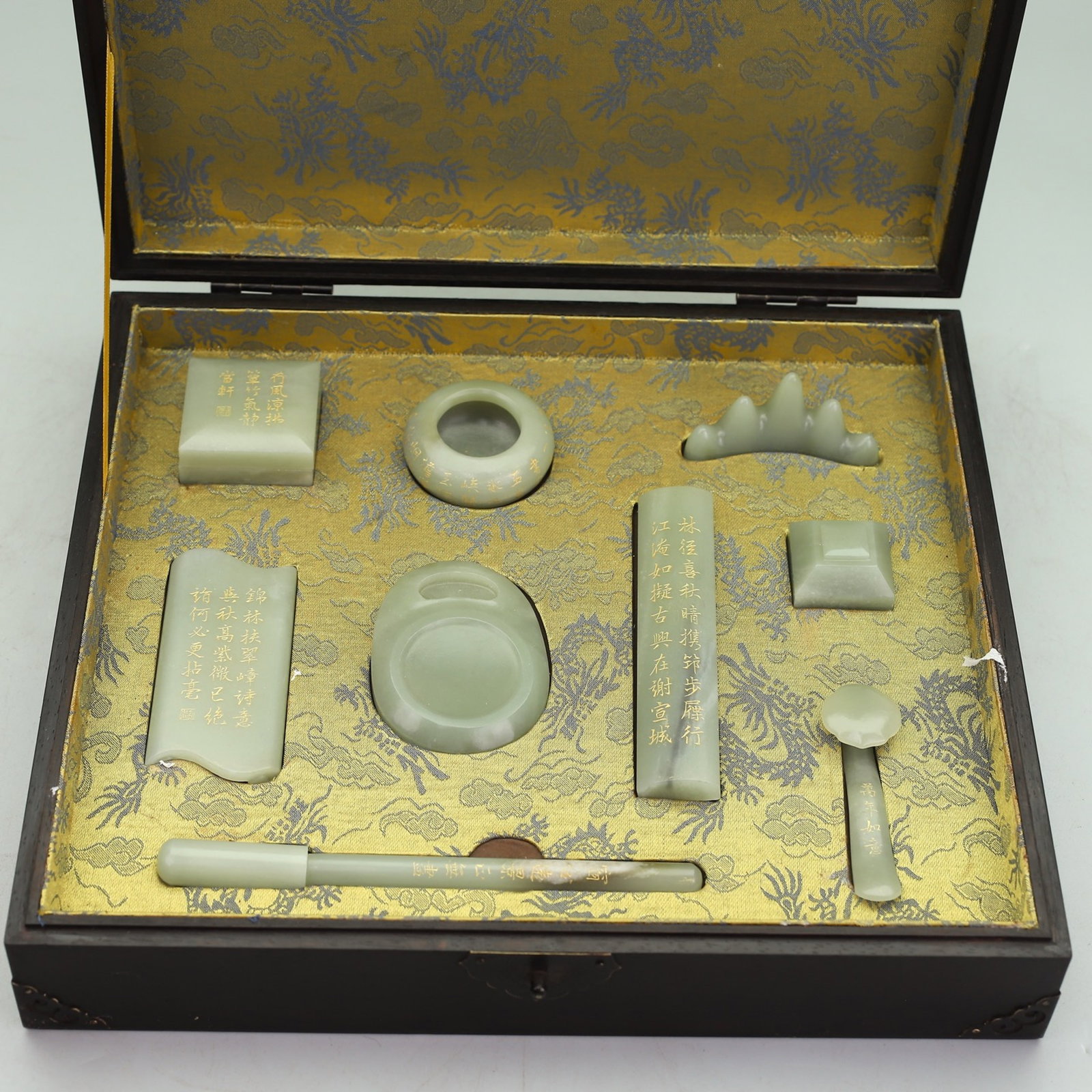 A Set of Fine White Jade Painted Gold Poem Ornaments: A Set of Fine White Jade Painted Gold Poem Ornaments,Qing Dynasty,China,Qianlong Four-character Mark,Size:(Box)13.8inx12.3inx3.7in,(Brush Holder)3inx0.8inx1.1inx1.8in,(Seal)1.5inx1.5inx1.1in,(Seal Box