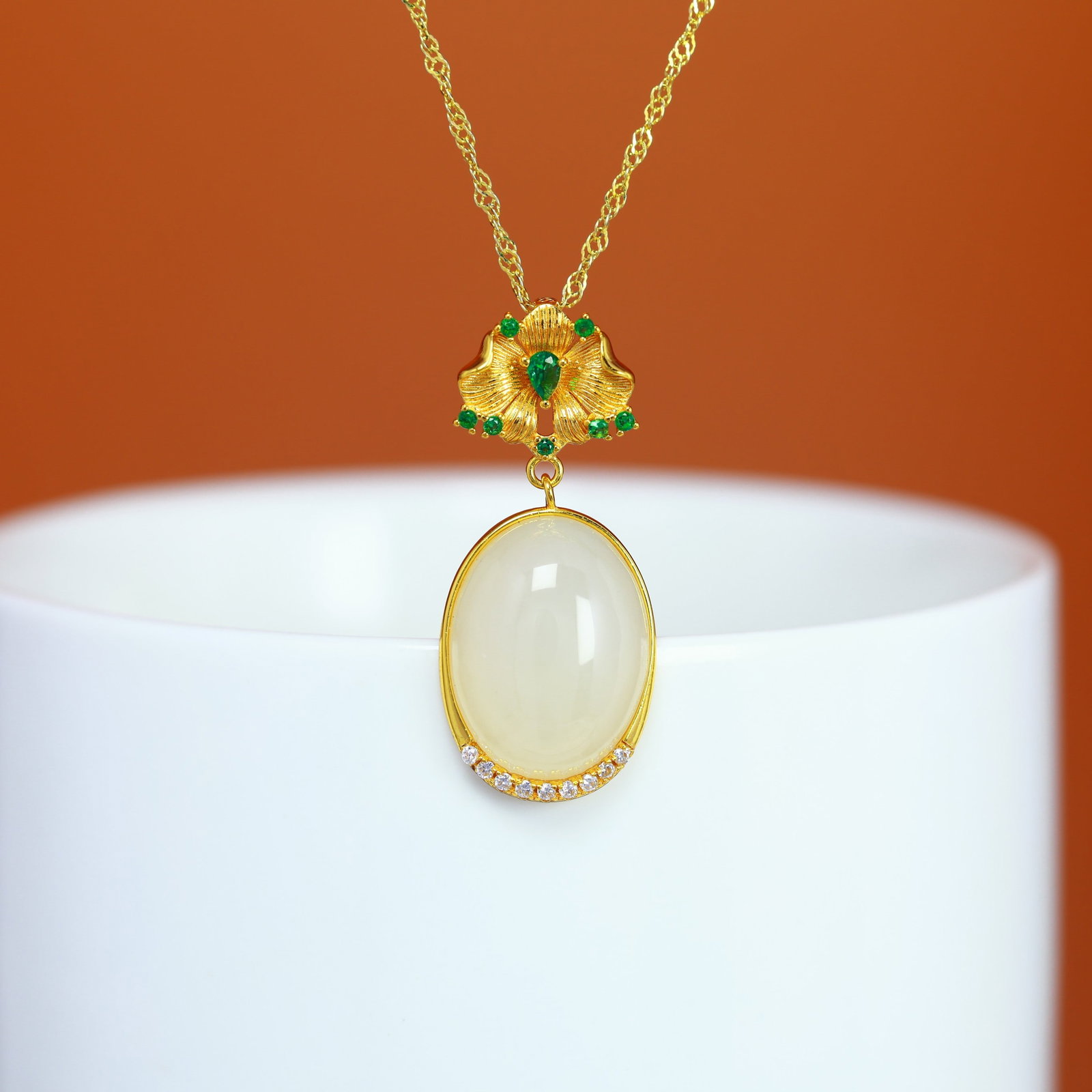 A Sterling Silver and White Jade Cabochon Pendant: A sterling silver pendant set with a white jade cabochon, Sise: 12mm×16 mm.
