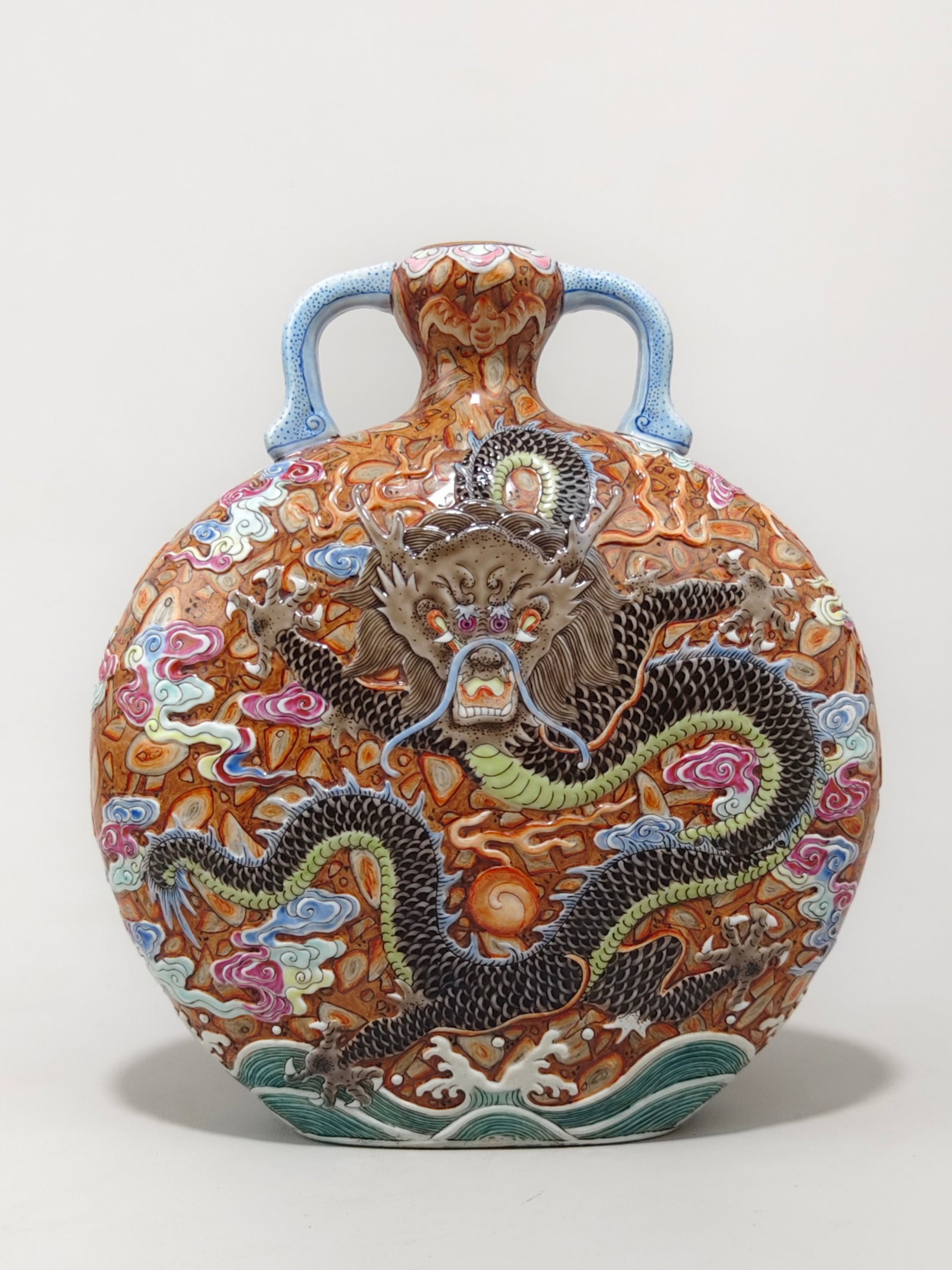 An Exquisite Famille-Rose Painted Gold Auspicious Cloud and Dragon Pattern Double-Ears Vase: An Exquisite Famille-Rose Painted Gold Auspicious Cloud and Dragon Pattern Double-Ears Vase,Qing Dynasty,China,Qianlong Six-character Mark,Size:8.5inx7.7in