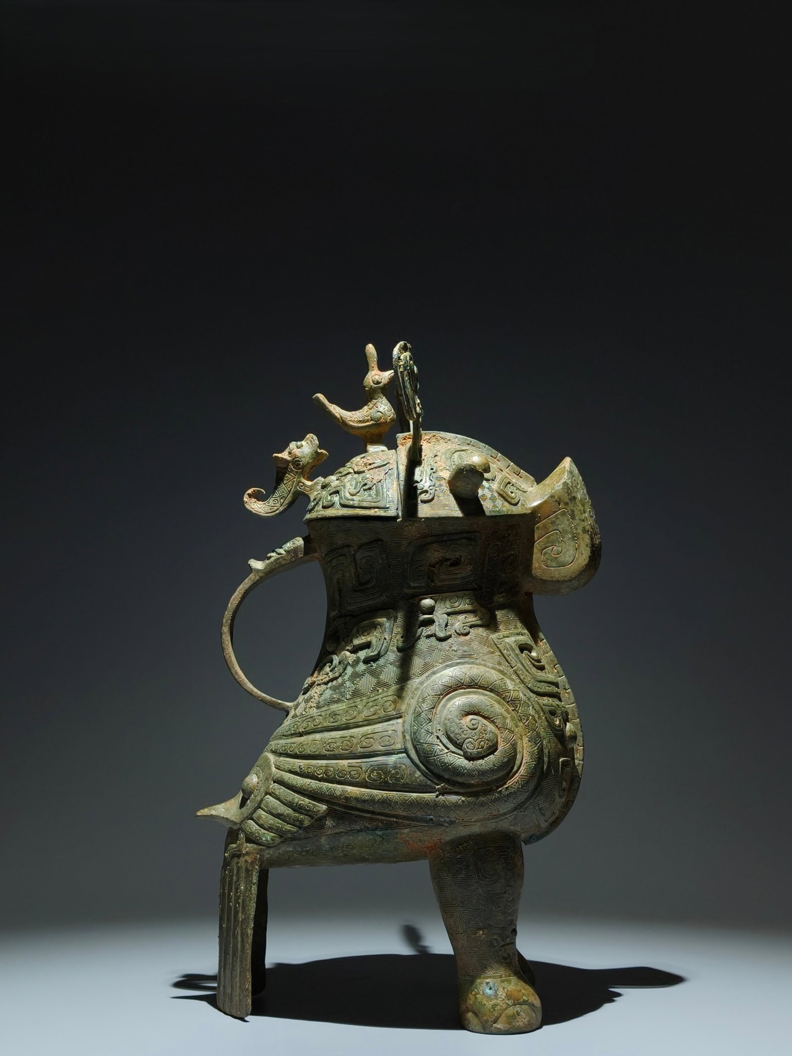 An Archaic Bronze Bird Zun: An Archaic Bronze Bird Zun,Shang Dynasty,China,Size:16.1inx9.1inx6.3in 青铜鸟尊,中国商代
