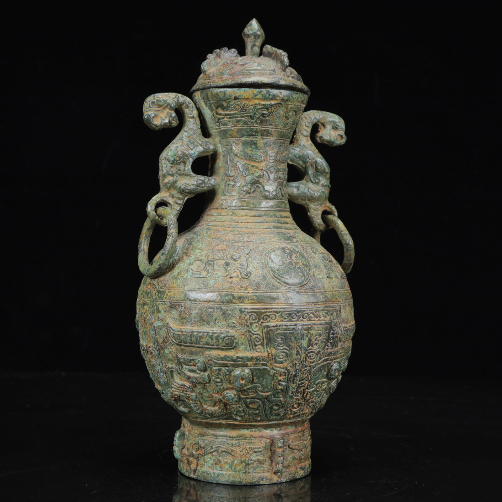 An Archaic Bronze Beast-Face Pattern Dragon-Ears Vase: An Archaic Bronze Beast-Face Pattern Dragon-Ears Vase,the Warring States Period in China,Size:4.7inx9.4in,Weight:1600g