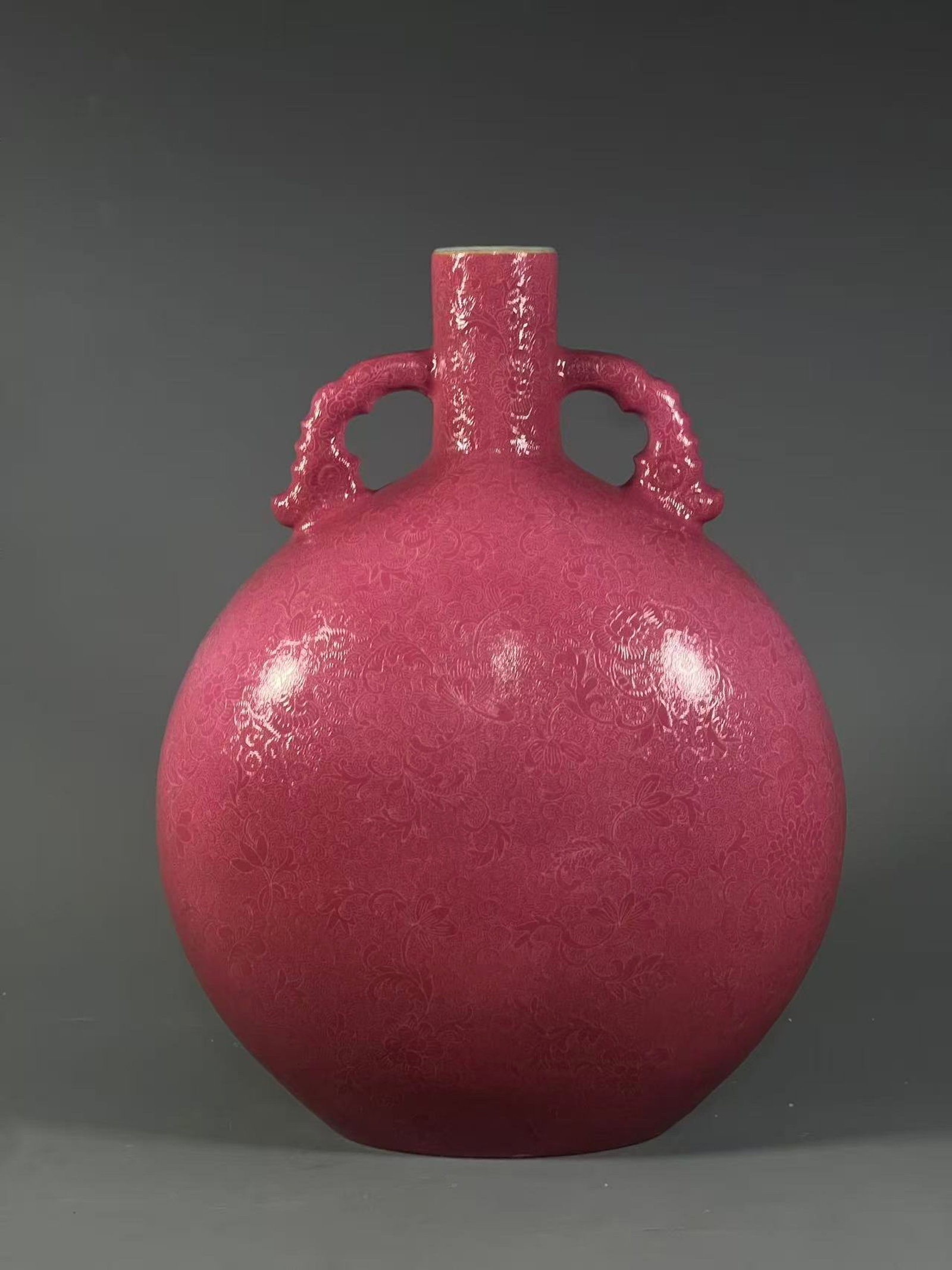 A Rare Ruby Red-Glazed Lotus Pattern Double-Ears Vase: A Rare Ruby Red-Glazed Lotus Pattern Double-Ears Vase,Qing Dynasty,China,Qianlong Six-character Mark,Size:14.4inx5.6in
