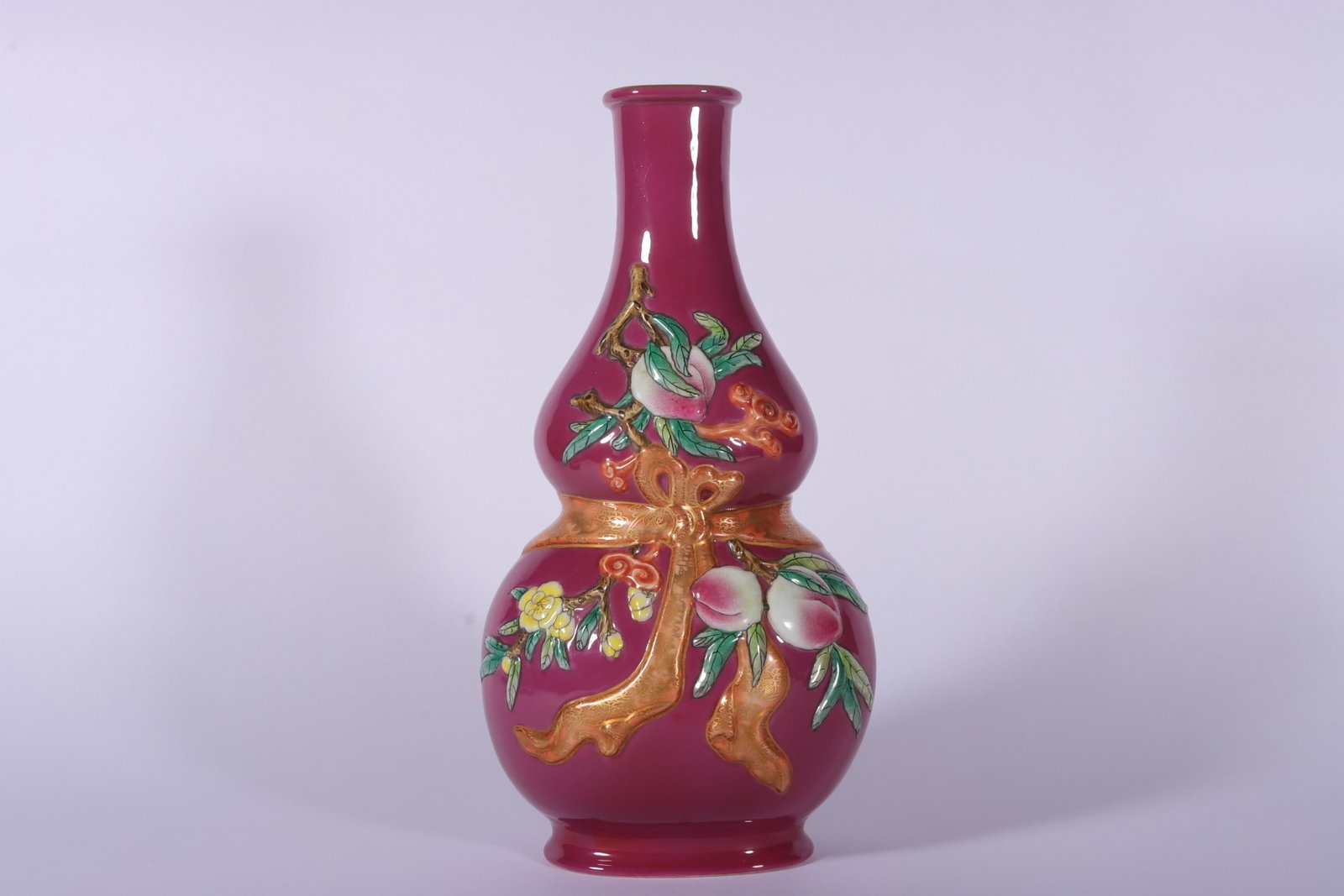 An Exquisite Ruby Red-Glazed Painted Gold Flower and Fruit Pattern Gourd-Shaped Vase: An Exquisite Ruby Red-Glazed Painted Gold Flower and Fruit Pattern Gourd-Shaped Vase,Qing Dynasty,China,Qianlong Six-character Mark,Size:11.2inx3.9in 胭脂红描金花&#