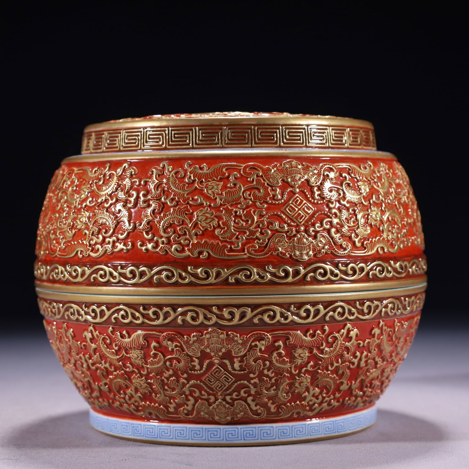 An Exquisite Red Glazed Painted Gold Lotus Pattern Box with Cover: An Exquisite Red Glazed Painted Gold Lotus Pattern Box with Cover,Qing Dynasty,China,Qianlong Six-character Mark,Size:6.3inx5.3in,Weight:1500g 红釉描金缠枝莲&