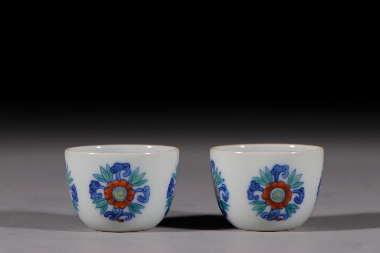 A Pair of Exquisite Doucai Flower Pattern Cups: A Pair of Exquisite Doucai Flower Pattern Cups,Qing Dynasty,China,With Mark,Size:1inx1.4in 一对斗彩花卉纹杯子,中国清代,