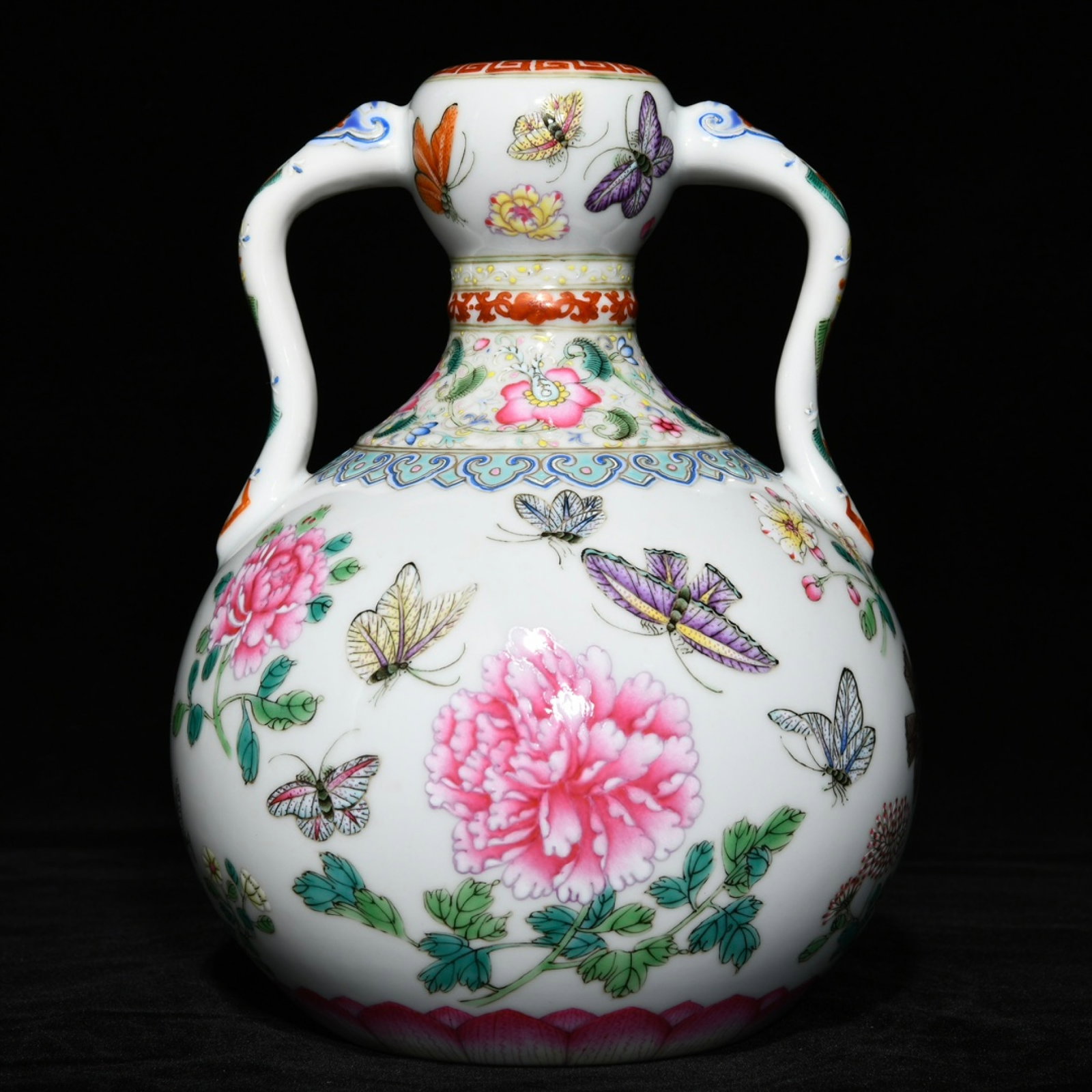 An Exquisite Famille-Rose Flower and Butterfly Pattern Double-Ears Vase: An Exquisite Famille-Rose Flower and Butterfly Pattern Double-Ears Vase,Qing Dynasty,China,Yongzheng Six-character Mark,Size:8.4inx6.7in 粉彩花卉蝴蝶纹双