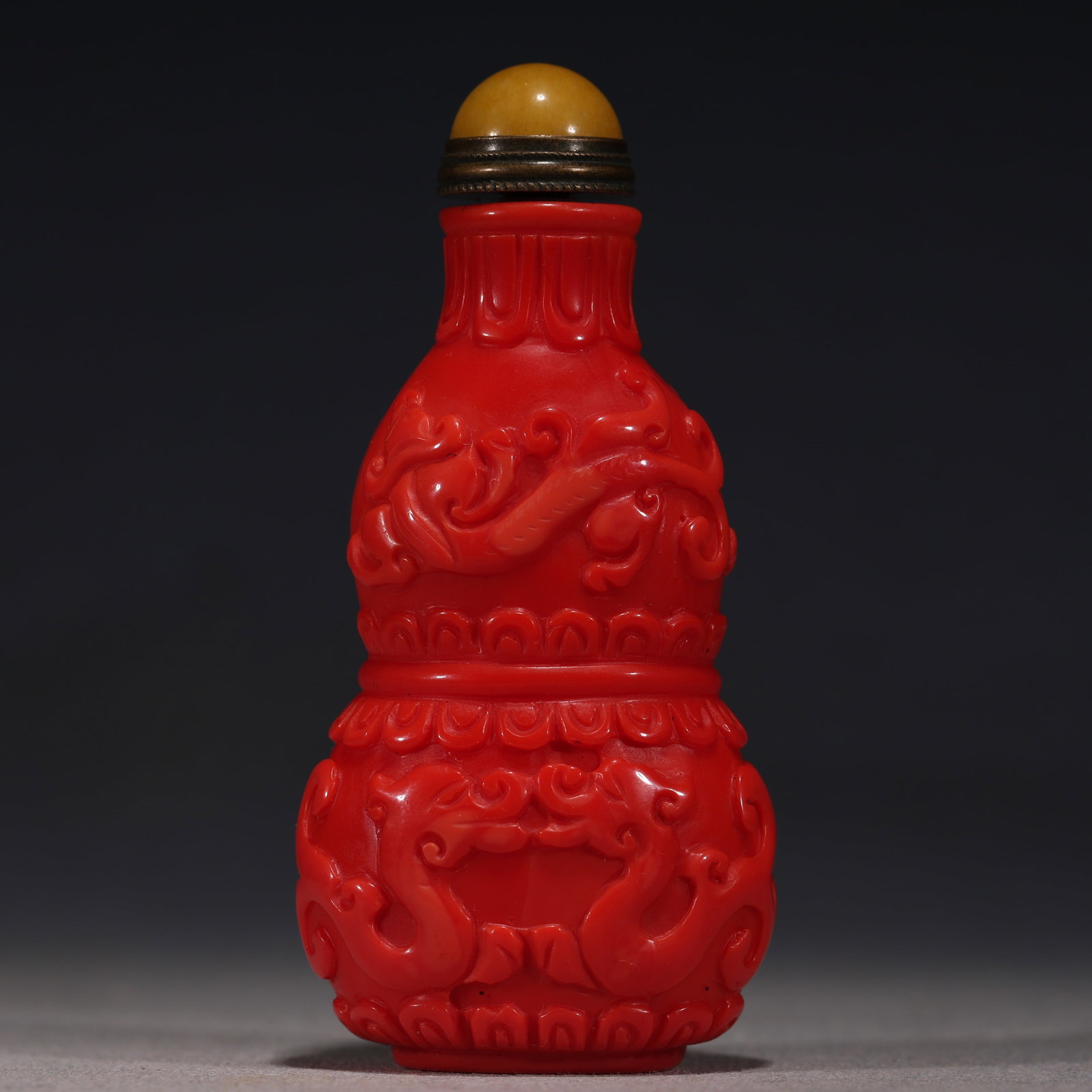 An Exquisite Coral Red Glass Cloud Dragon Pattern Gourd-shaped Snuff Bottle: An Exquisite Coral Red Glass Cloud Dragon Pattern Gourd-shaped Snuff Bottle,Qing Dynasty, China,Yongzheng Four-character Mark,Size:1.6in×1in×3.3in 珊瑚红琉璃