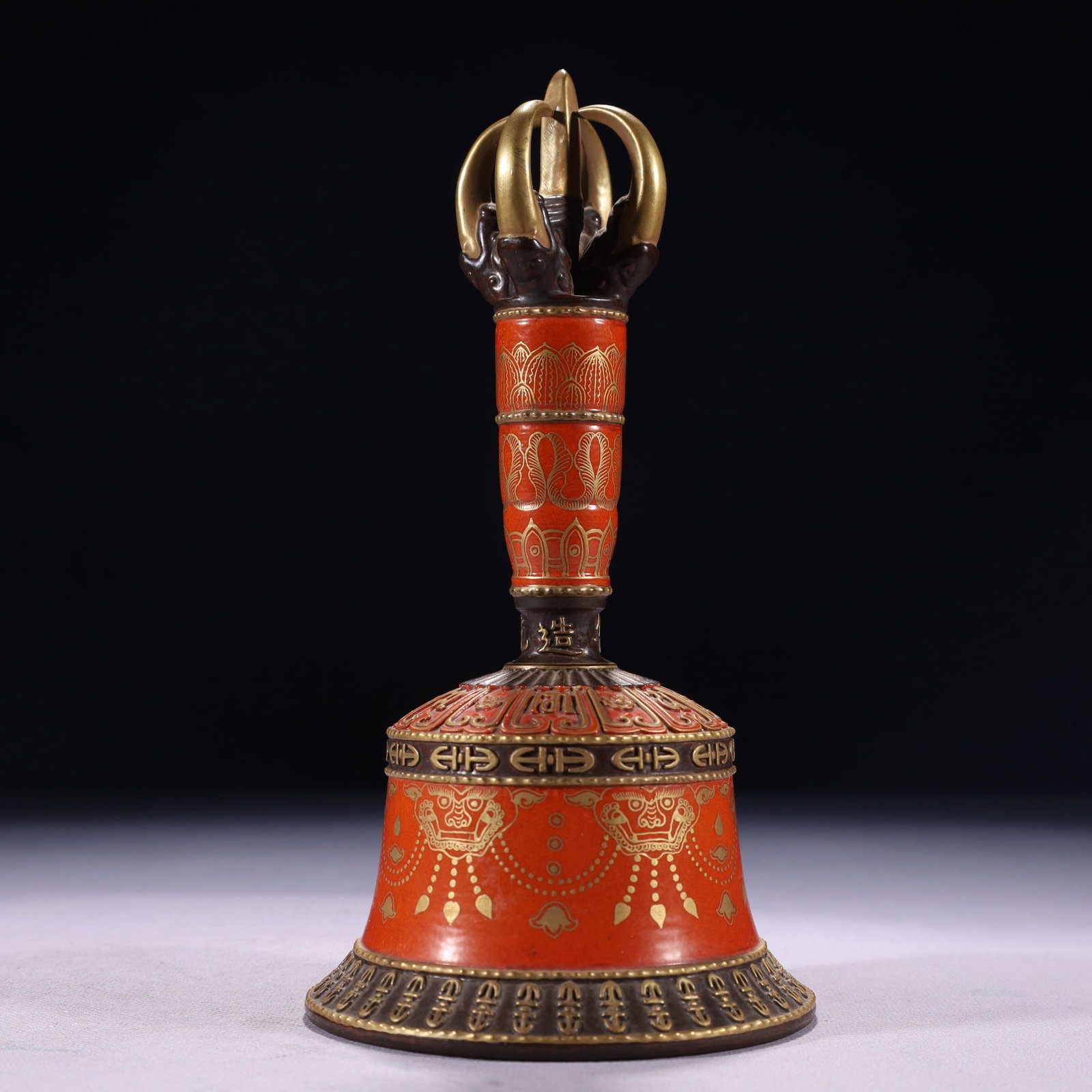 An Exquisite Red Glazed Painted Gold Beast-Face Pattern Ornament,With Sanskrit: An Exquisite Red Glazed Painted Gold Beast-Face Pattern Ornament,With Sanskrit,Qing Dynasty,China,Qianlong Four-character Mark,Size:4.1inx7.9in,Weight:400g 红釉描金兽&