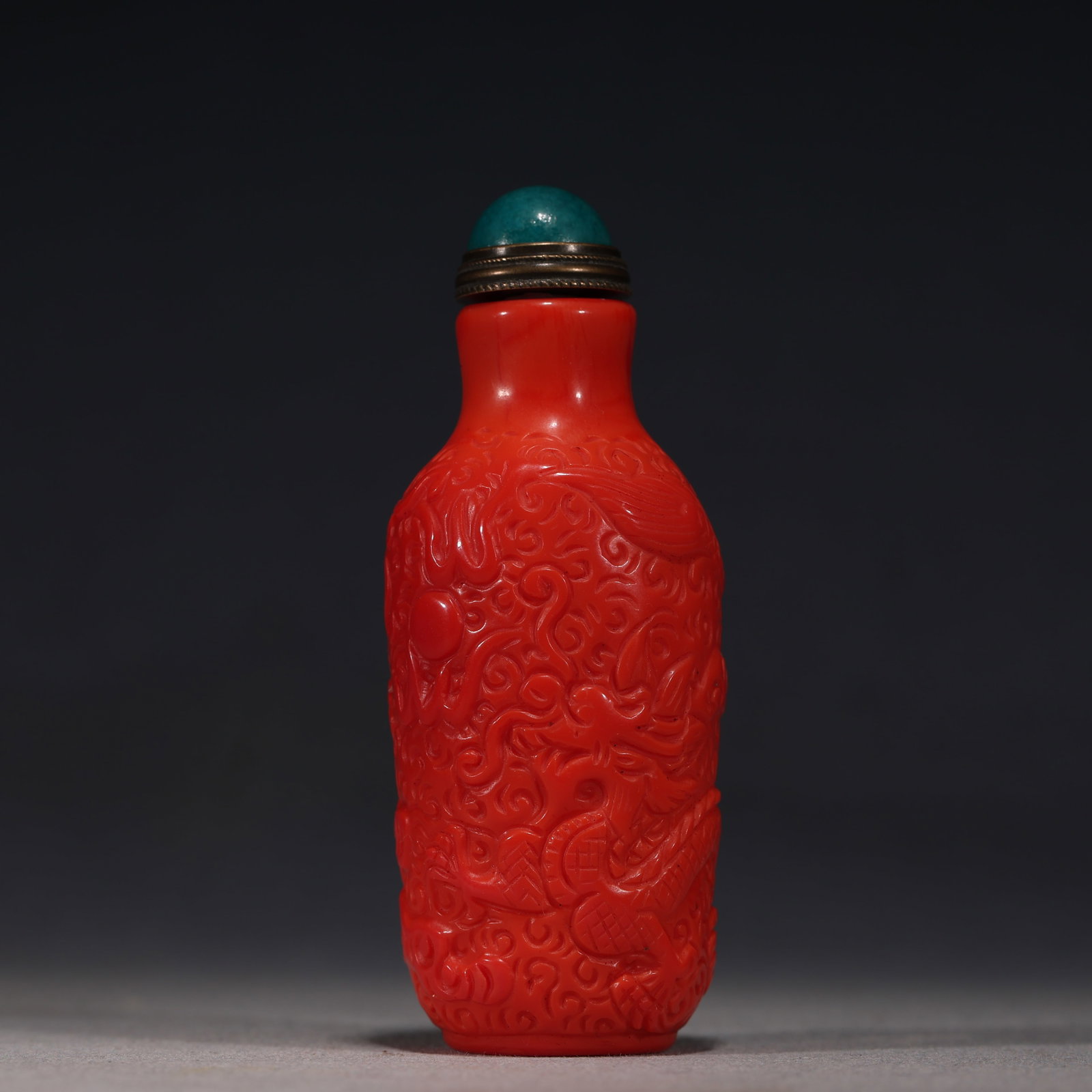 An Exquisite Coral Red Glass Cloud Dragon Playing Pearl Pattern Snuff Bottle: An Exquisite Coral Red Glass Cloud Dragon Playing Pearl Pattern Snuff Bottle,Qing Dynasty, China,Qianlong Four-character Mark,Size:1.2in×1.2in×3.1in 珊瑚红琉璃&