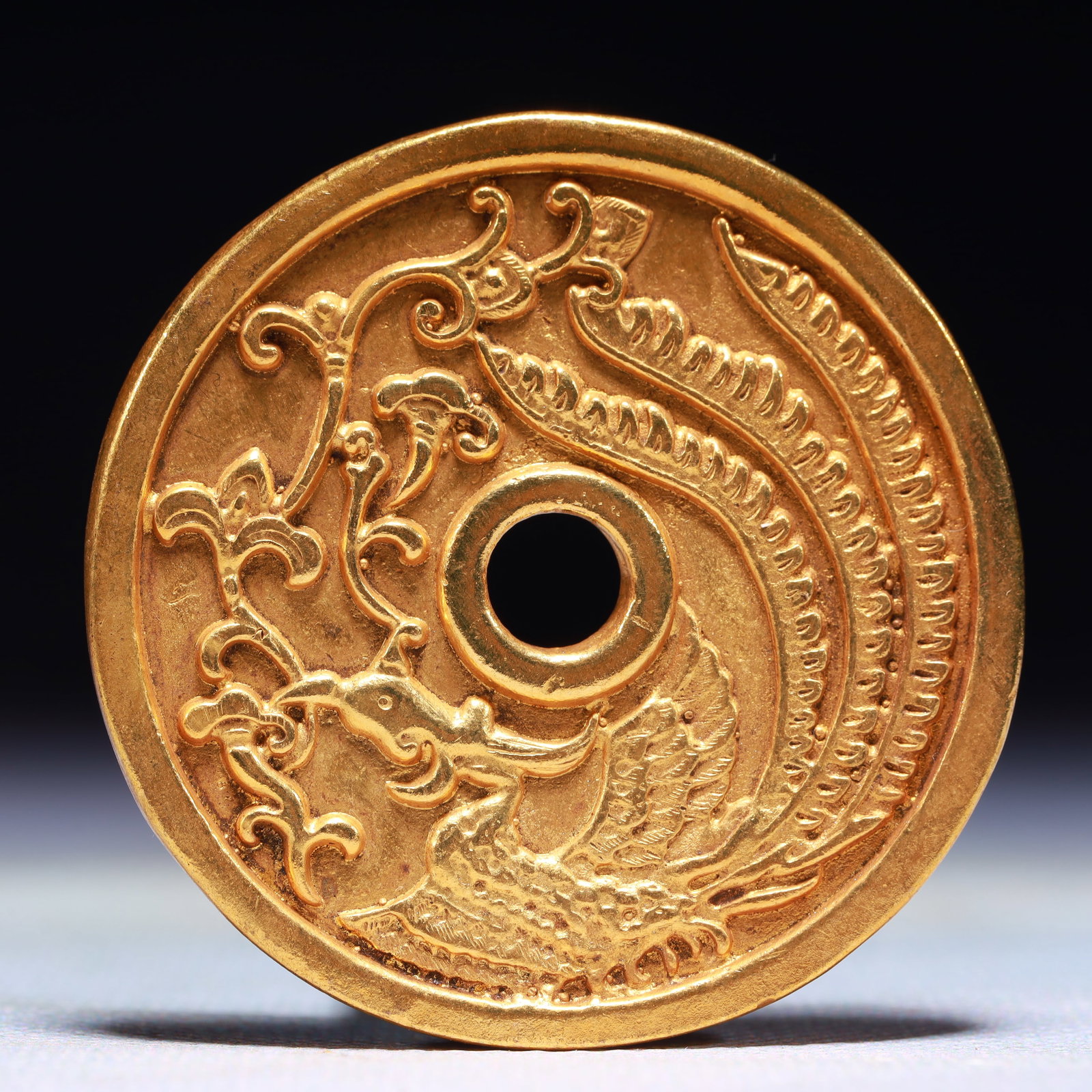 An Exquisite Gilt Bronze Phoenix Pattern Cash Coin: An Exquisite Gilt Bronze Phoenix Pattern Cash Coin,Han Dynasty,China,Size:2in,Weight:42.8g 铜鎏金凤纹钱币,中国汉代