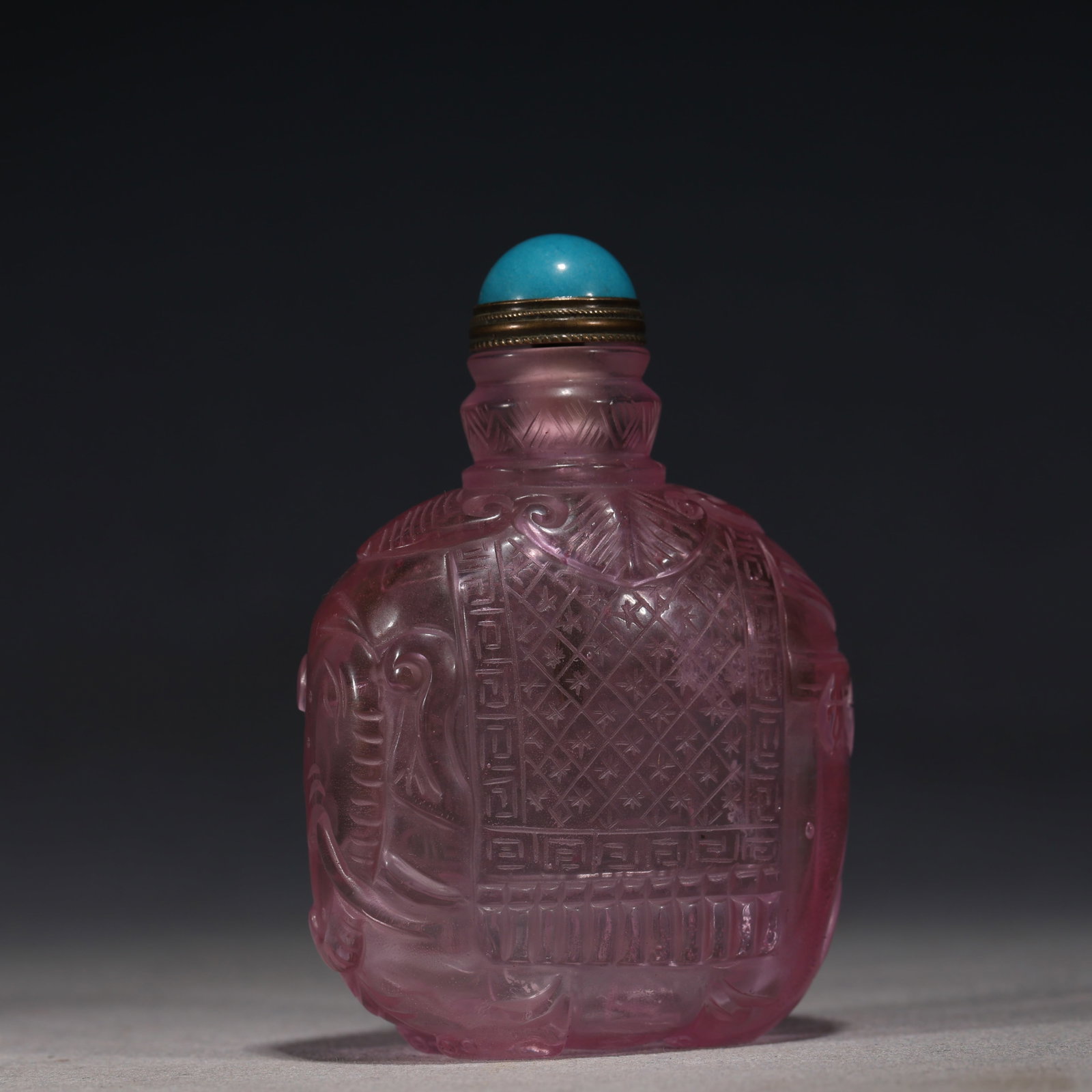 An Exquisite Pink Glass Elephant of Peace Pattern Snuff Bottle: An Exquisite Pink Glass Elephant of Peace Pattern Snuff Bottle,Qing Dynasty, China,Qianlong Four-character Mark,Size:2.4in×1.2in×3.1in