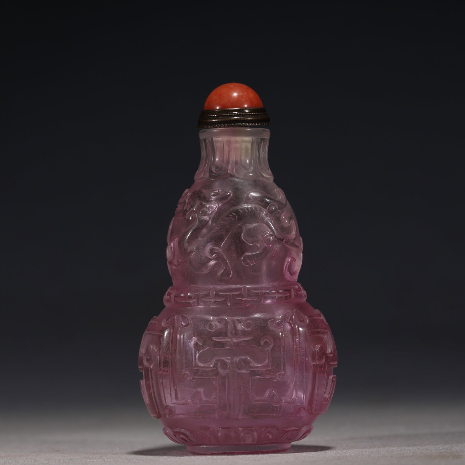 An Exquisite Pink Relief Chilong Dragon Pattern Gourd-shaped Snuff Bottle: An Exquisite Pink Relief Chilong Dragon Pattern Gourd-shaped Snuff Bottle,Qing Dynasty, China,Qianlong Four-character Mark,Size:2in×1in×3.3in