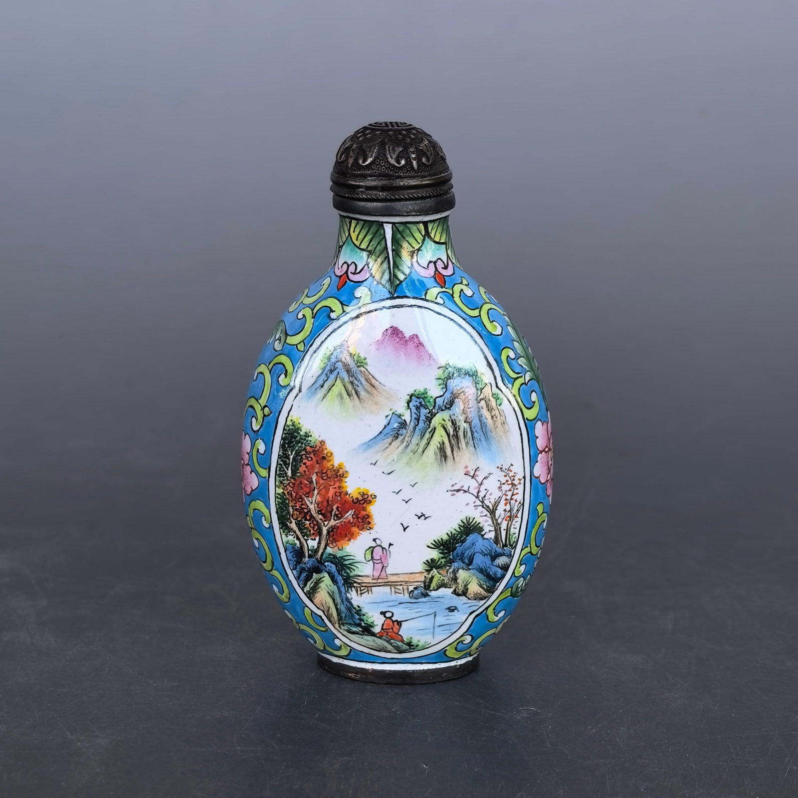 An Exquisite Painted Enamel Landscape and Figure Pattern Snuff Bottle: An Exquisite Painted Enamel Landscape and Figure Pattern Snuff Bottle,Qing Dynasty,China,Qianlong Four-character Mark,Size:1.8inx1.2inx3in,Weight:64g 画珐琅山水人&#