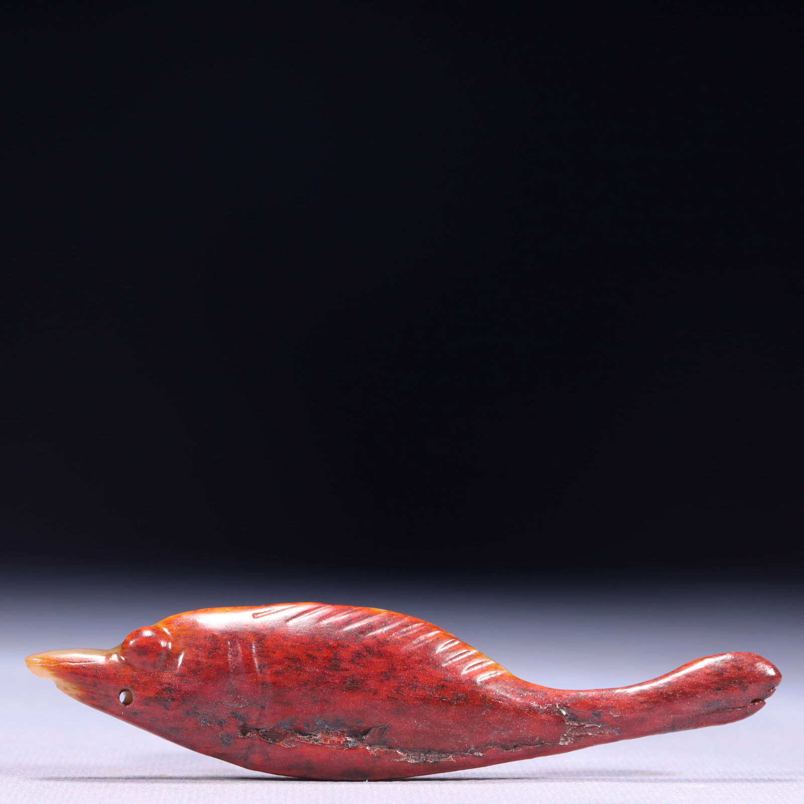An Exquisite Archaic Jade Fish Ornament: An Exquisite Archaic Jade Fish Ornament,Ancient Time,China,Size:4.3inx0.2inx1in,Weight:29g 高古玉鱼摆件,中国远古时期
