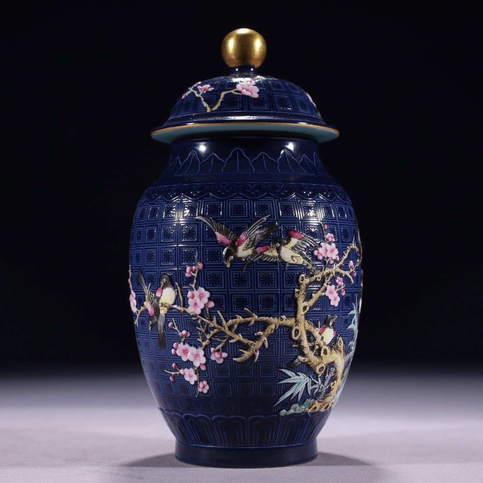 An Exquisite Blue Ground Famille-Rose Painted Gold Flower and Bird Pattern Jar with Cover: An Exquisite Blue Ground Famille-Rose Painted Gold Flower and Bird Pattern Jar with Cover,Qing Dynasty,China,Qianlong Six-character Mark,Size:3.5inx7.5in,Weight:550g 蓝地粉彩&#