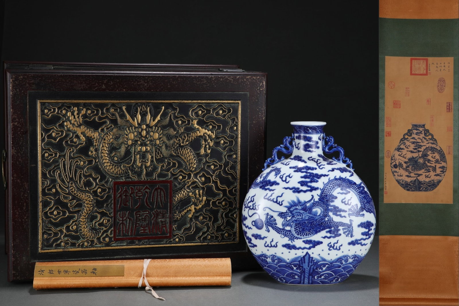 A Rare Blue and White Seawater and Dragon Pattern Double-Ears Vase,with Chinese Vertical Scroll Ink: A Rare Blue and White Seawater and Dragon Pattern Double-Ears Vase,with Chinese Vertical Scroll Ink Painting on Silk,Qing Dynasty,China,Qianlong Six-character Mark,Size:(Silk)25.2inx11.8in,(Porcelain)