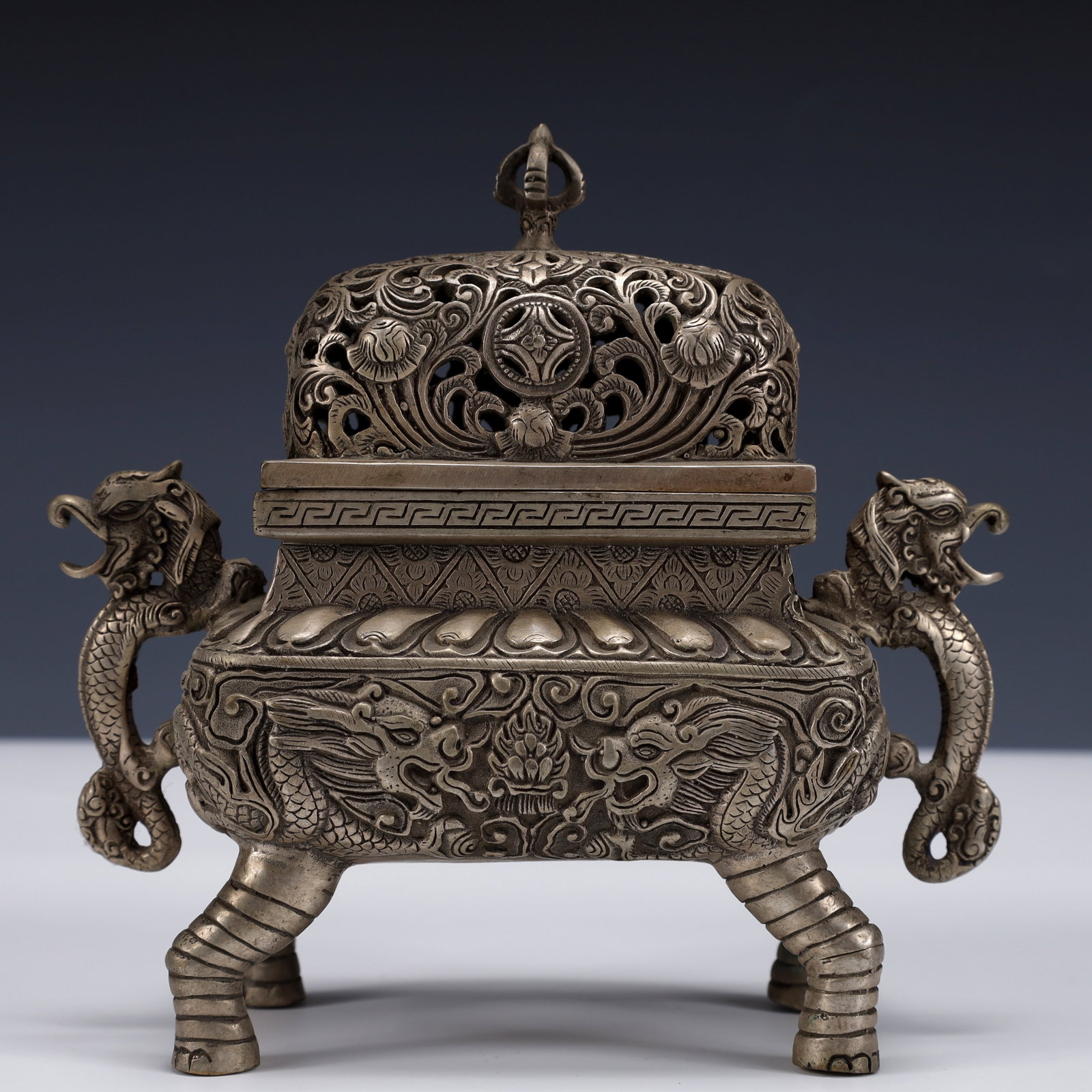 An Exquisite Silver-Plated Bronze Dragon Pattern Double-Ears and Four legs Censer: An Exquisite Silver-Plated Bronze Dragon Pattern Double-Ears and Four legs Censer ,The Republic of China,Size:6.3inx3.1inx6.3in,Weight:850g 铜镀银龙纹双耳