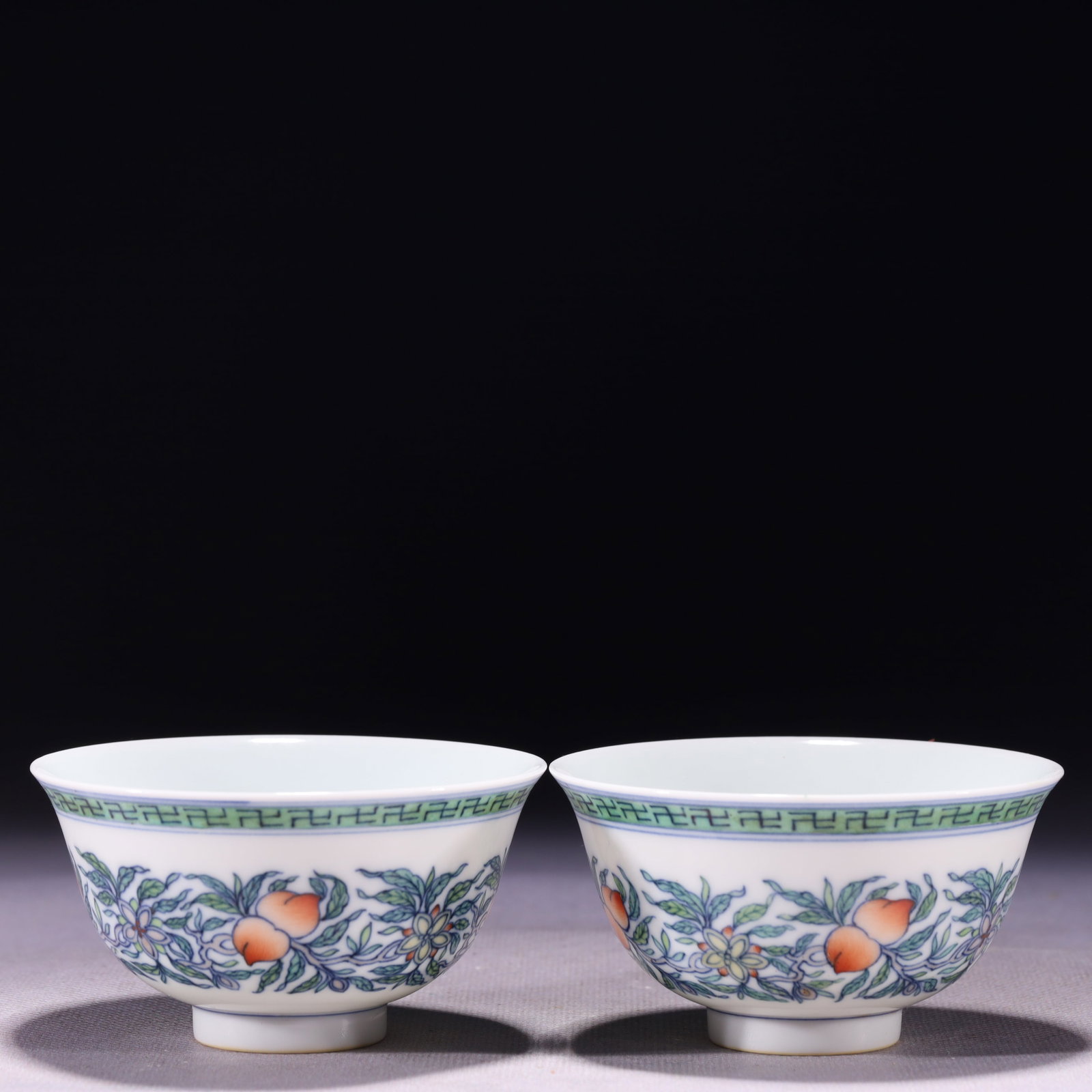 A Pair of Exquisite Doucai Flower and Fruit Pattern Cups: A Pair of Exquisite Doucai Flower and Fruit Pattern Cups,Qing Dynasty,China,Yongzheng Six-character Mark,Size:3.4inx1.9in,Weight:131g