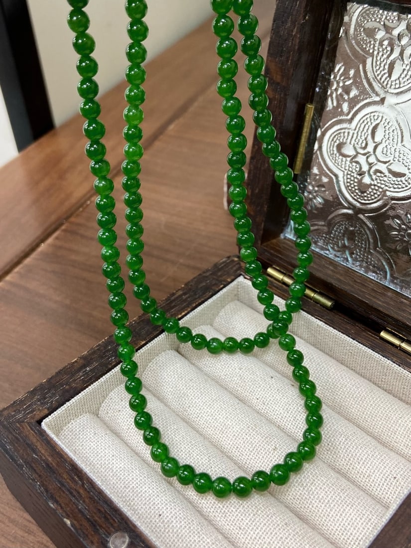 A Finely Carved Hetian Jade 'Ice-Bottom Spicy Yang Green' Necklace (1 of 6)