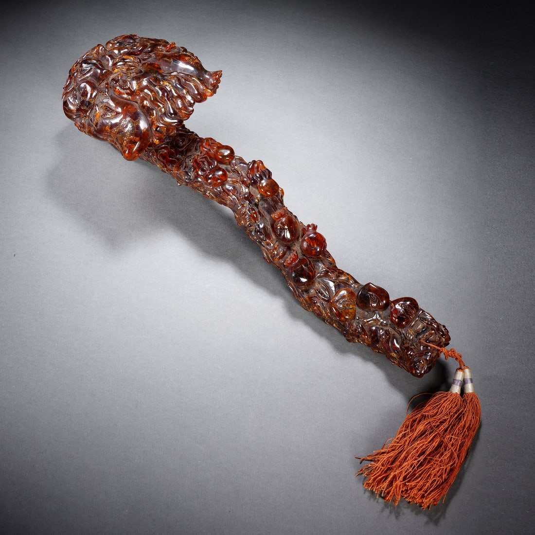 An Exquisite Amber Ruyi Ornament Carved With Three Blessing Patterns (1 of 9)