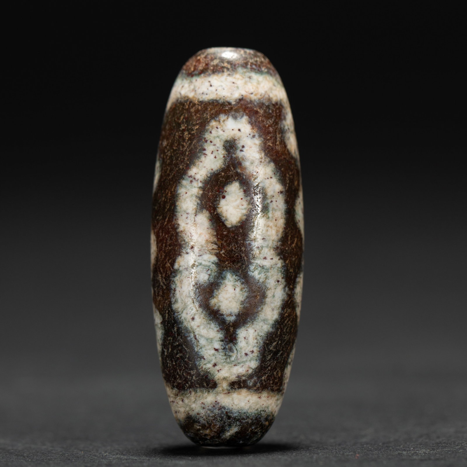 An Exquisite Two-Eyed Dzi Bead With Special Totem (1 of 8)