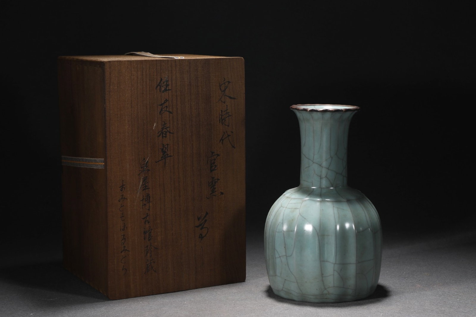 An Exquisite Guan Kiln Celadon Glaze Multi-Faceted Vase With Bronze Mounted Rim: An Exquisite Guan Kiln Celadon Glaze Multi-Faceted Vase With Bronze Mounted Rim,Song Dynasty,China,Size:8.9inx5.3in,官窑青釉镶紫铜扣多棱