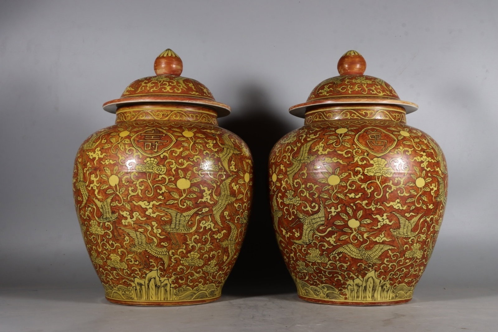 A Pair Of Fine Overglaze Red Hundred Cranes Jars With Longevity Motifs On Yellow Ground (1 of 9)