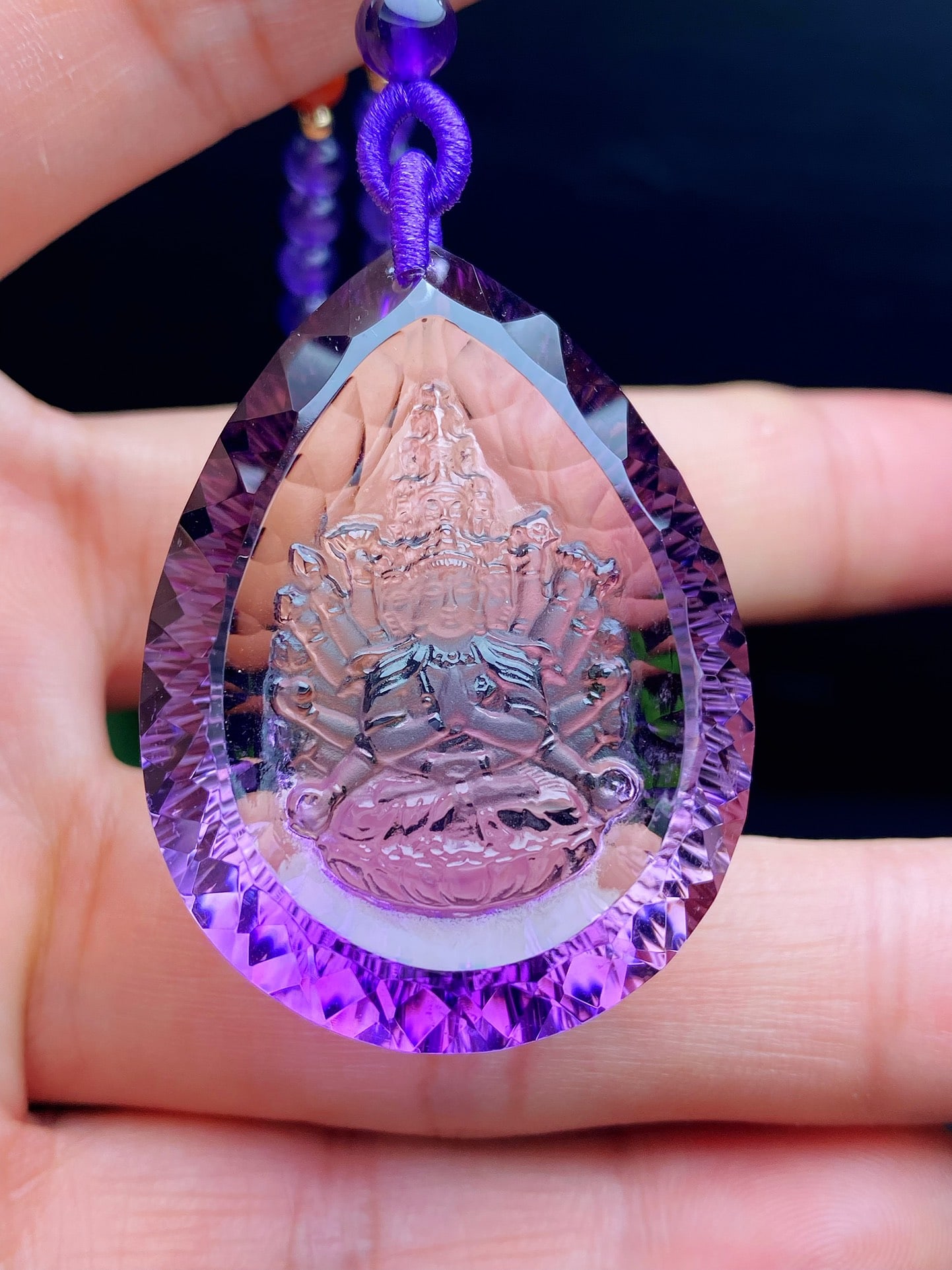 An Exquisite Natural Amethyst Thousand-Armed Avalokitesvara Pendant: An Exquisite Natural Amethyst Thousand-Armed Avalokitesvara Pendant. Dreamy violet hue, pure crystal, millennium-facet cut, finely carved Thousand-Armed Avalokitesvara. Size: 42×31×13mm; wei