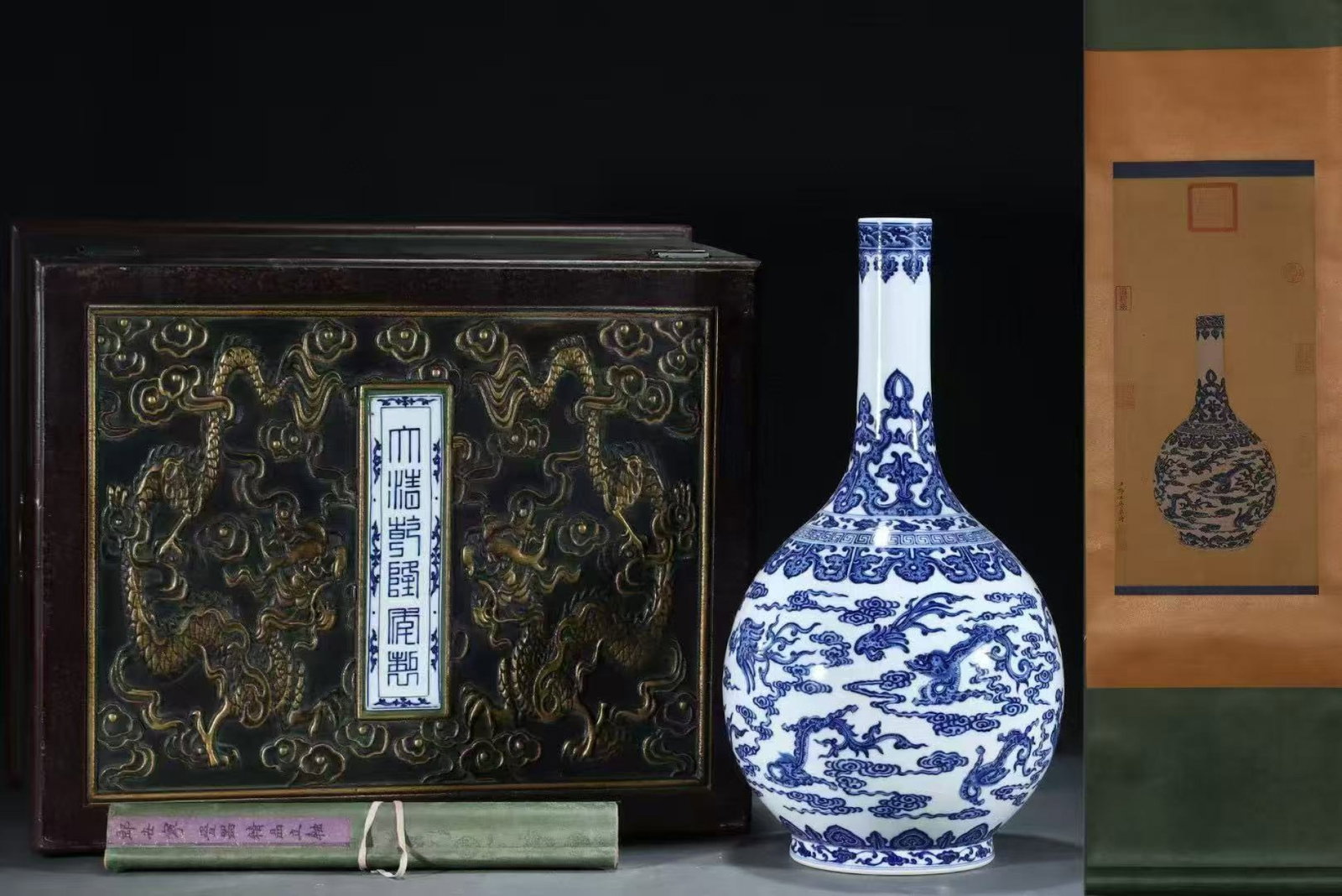 A Huge Blue and White Auspicious Cloud and Phoenix Pattern Vase,with Chinese Vertical Scroll Ink: A Huge Blue and White Auspicious Cloud and Phoenix Pattern Vase,with Chinese Vertical Scroll Ink Painting on Silk,Qing Dynasty,China,Qianlong Six-character
