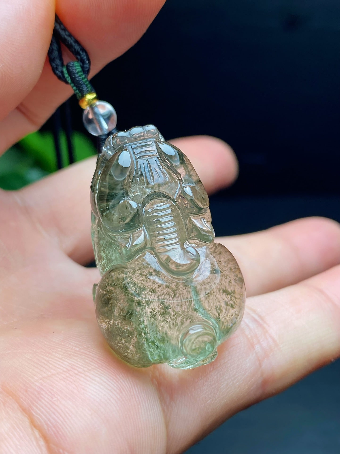 An Exquisite Natural Green Phantom Quartz Pixiu Pendant: An Exquisite Natural Green Phantom Quartz Pixiu Pendant. Translucent crystal enclosing a green phantom landscape. Size: 36×22×18mm; weight: 23g.