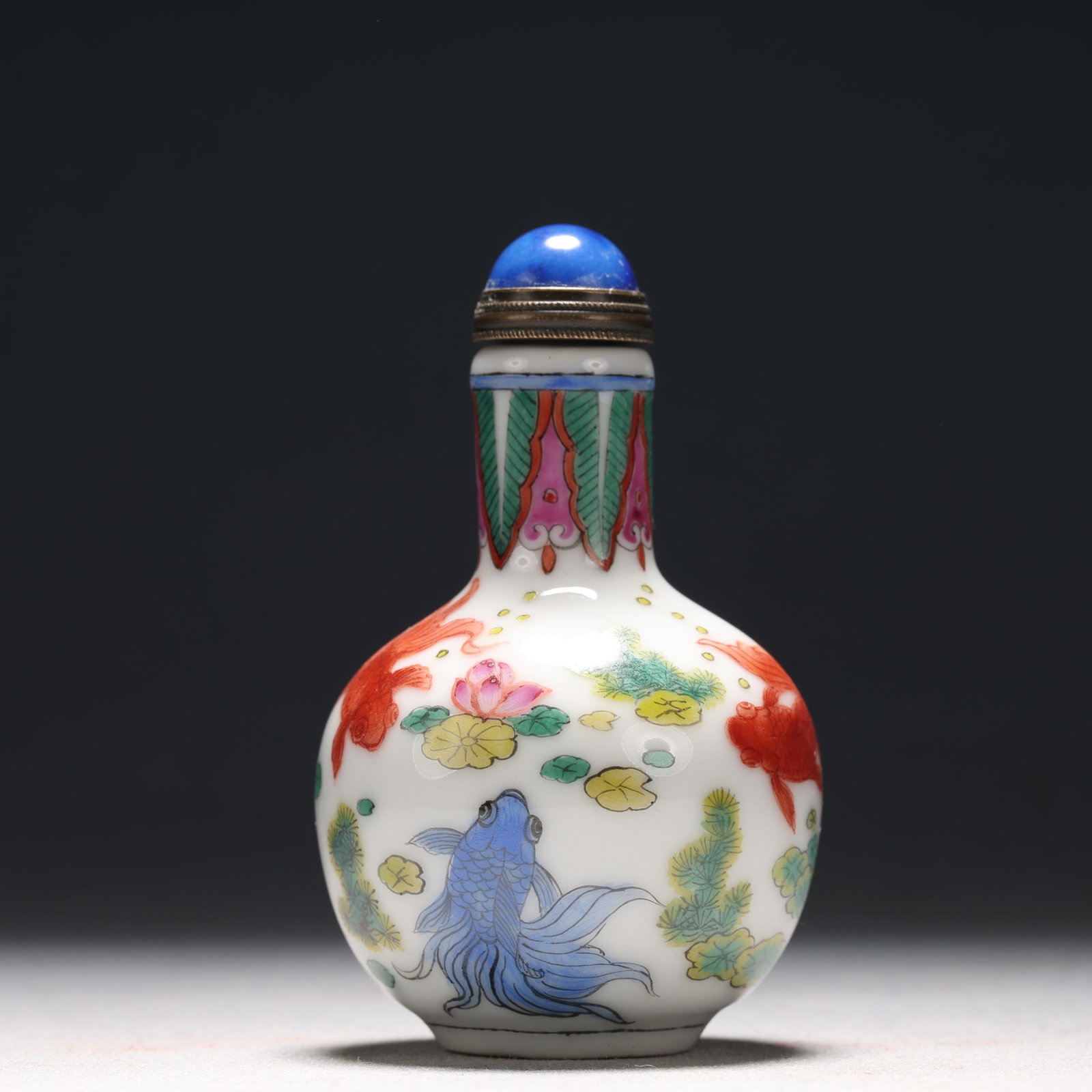 A Fine Enamel Flower and Fish Pattern Porcelain Snuff Bottle: A Fine Enamel Flower and Fish Pattern Porcelain Snuff Bottle, Qing Dynasty, China, Qianlong Four-character Mark, Size:1.8inx3in 瓷胎画珐琅彩花卉鱼