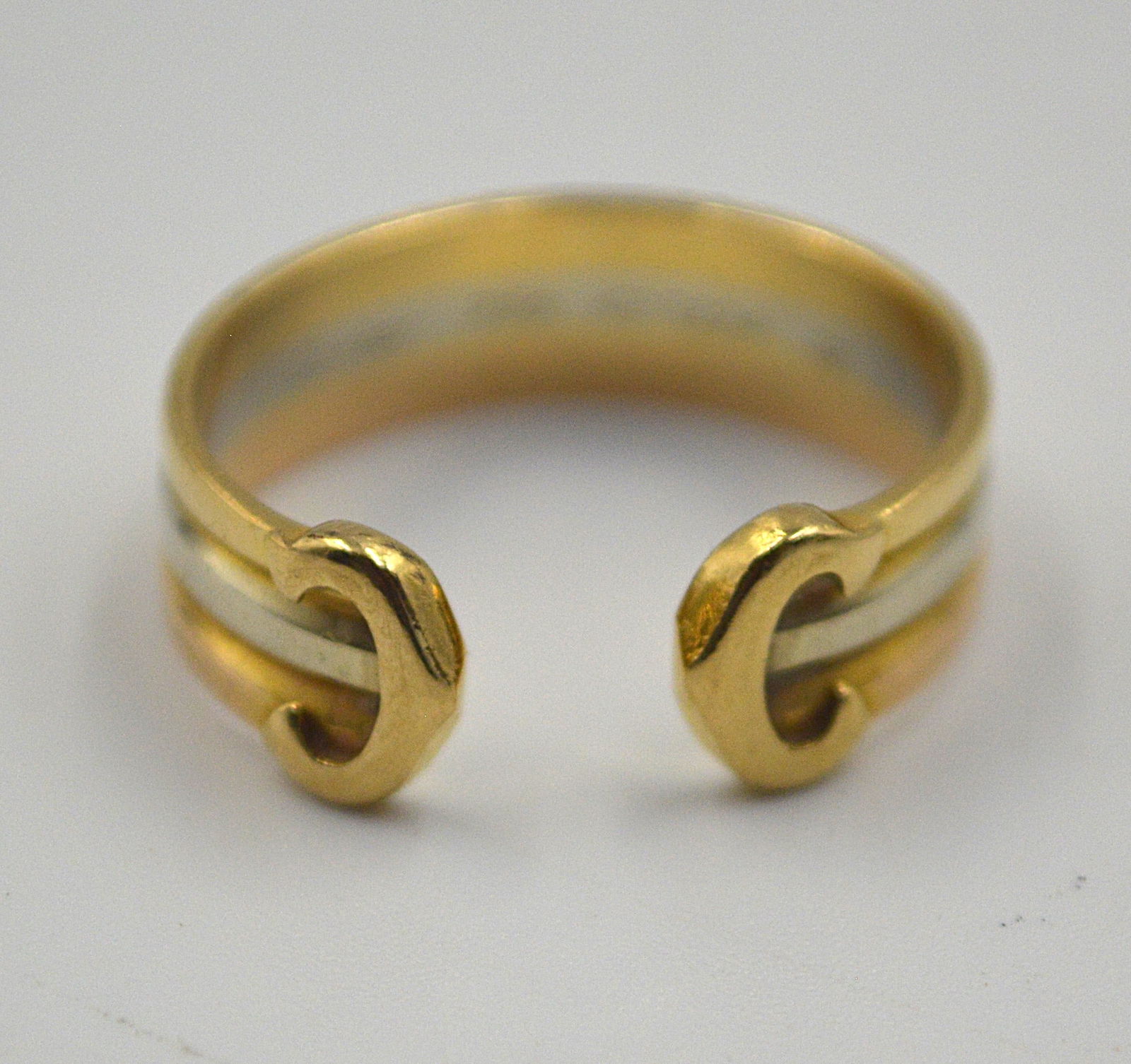 Cartier 18k White and Yellow Gold Ring: Cartier 18k, white and yellow gold ring Weighs: 3.7 grams Size: 7, slightly adjustable.