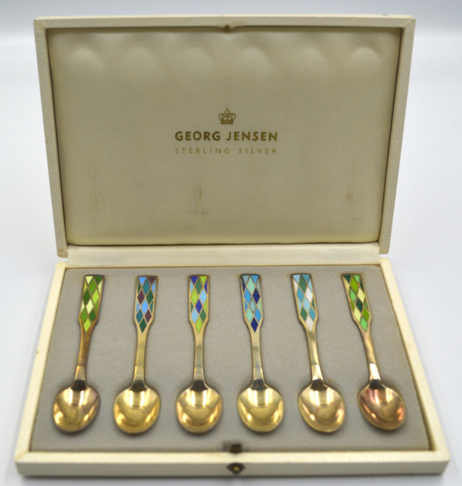 Boxed set of 6 Georg Jensen Enameled Teaspoons: 6 enameled Georg Jensen teaspoons, in original box. Measures: 4 inches in length