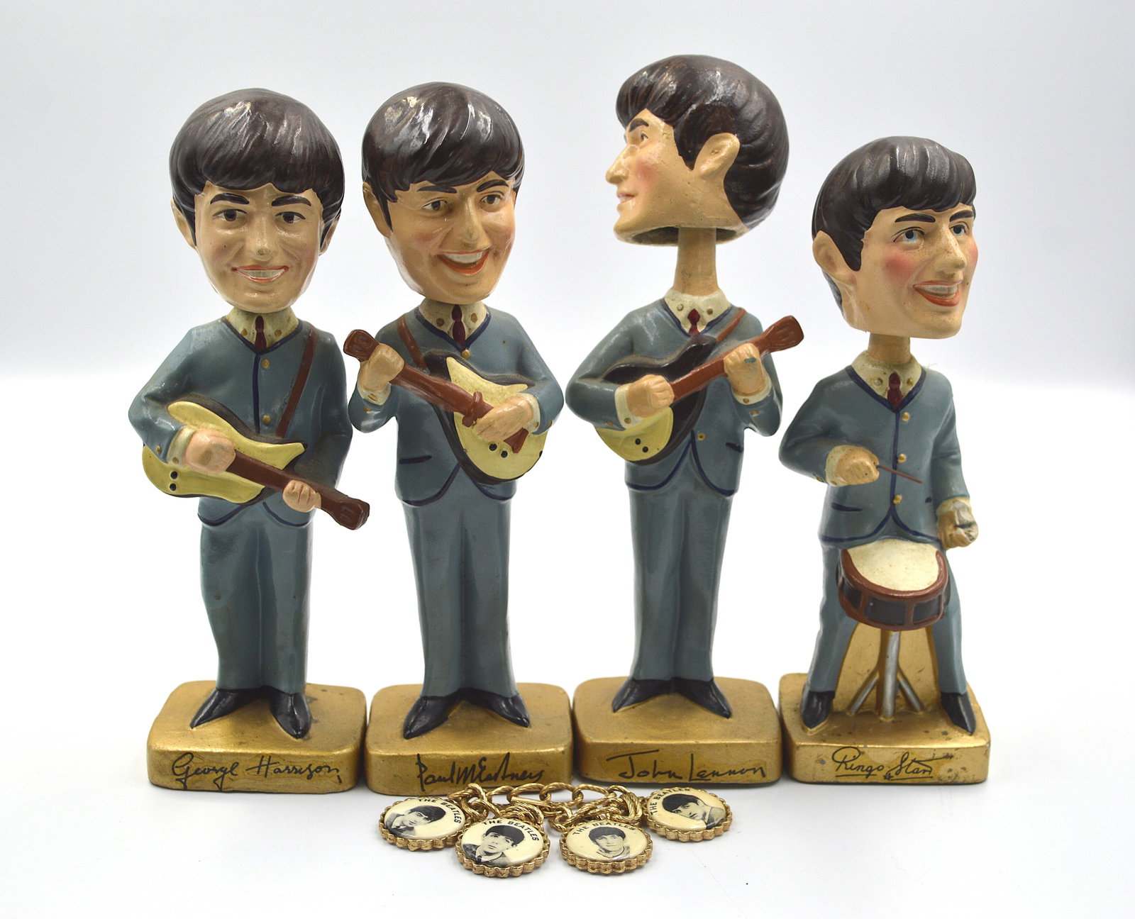 Beatles Bobblehead set and Beatles Charm Bracelet: Vintage 1960's era Beatles bobble head dolls. Vintage Beatles novelty bracelet charm bracelet. Measures: 8 Inches high