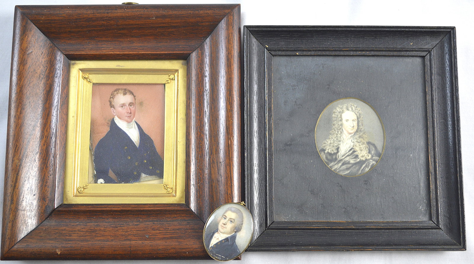 Three Antique Miniatures: 3 Antique Miniature Paintings. Measurements: Small oval painting of a gentleman with a washed gold back frame: around 1.75 in height by 1.5 width Gilt wooden frame: frame measures 8.75 in height by 7.