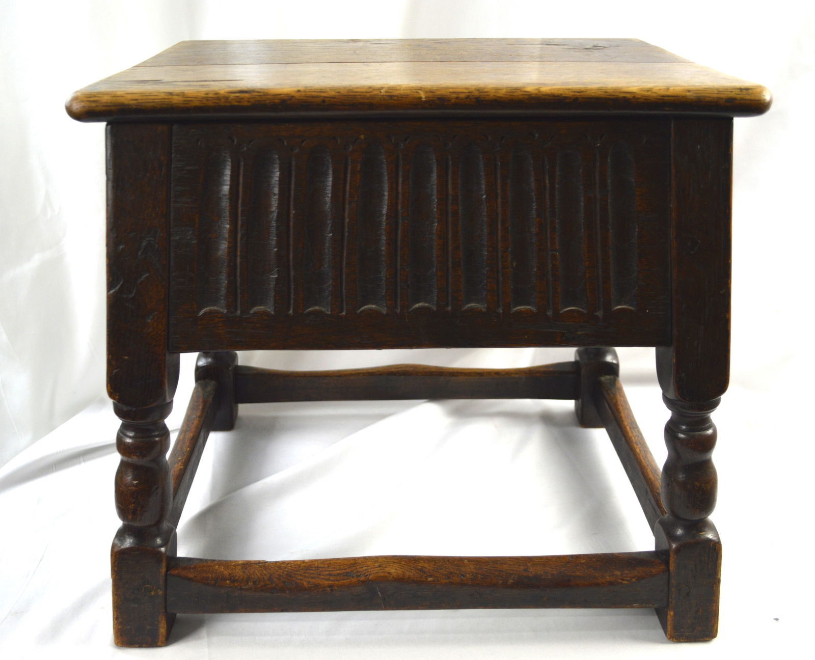 Antique Oak Coffin Table (stool): Antique 18th Century hand carved, Solid Oak English Coffin Table (stool) with a hinged lift table top for storage. Measures: 18 inches high by 18 inches wide. The lift top measures 13 inches high by 1
