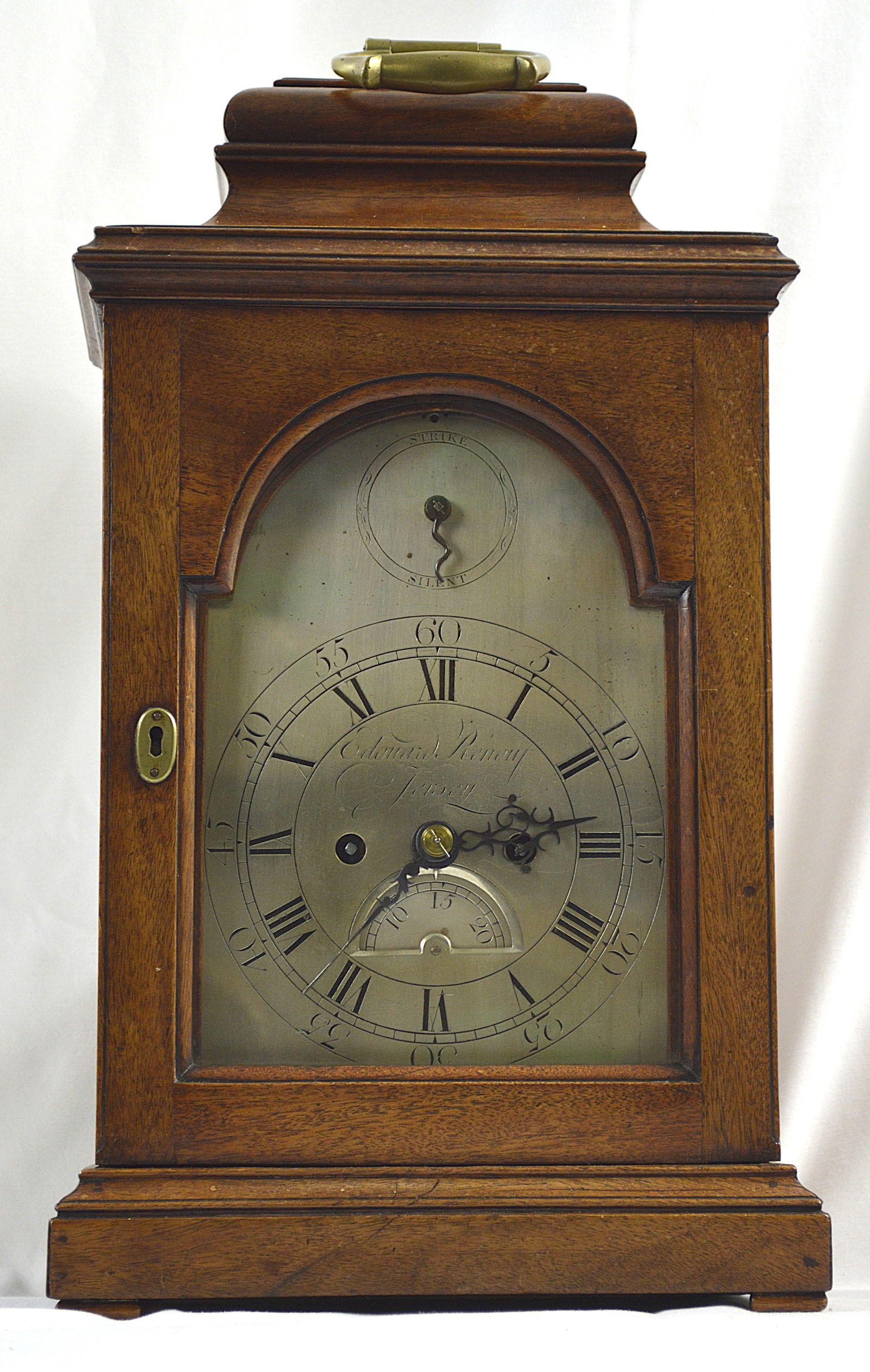 Renouf Georgian Mantle clock. Channel Islands: Antique mantle clock made by Renouf, Jersey, Channel Islands. Clock has the date and chimes and an open back. Measures: 19 inches high by 11 inches wide by 7.5 inches deep