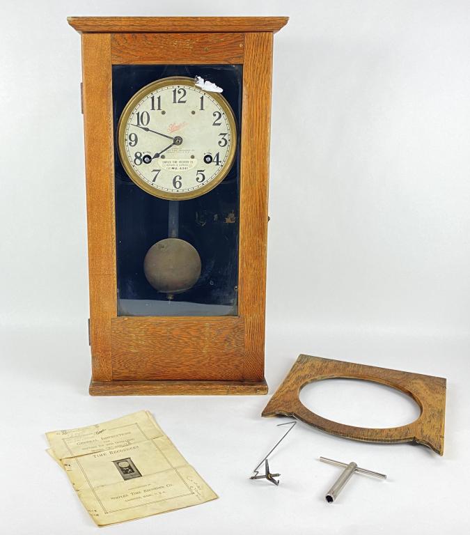 Simplex Model T Time Recorder: Does no run and piece photographed outside of clock appears to be damaged. Comes with key. Height: 26" Width: 14"