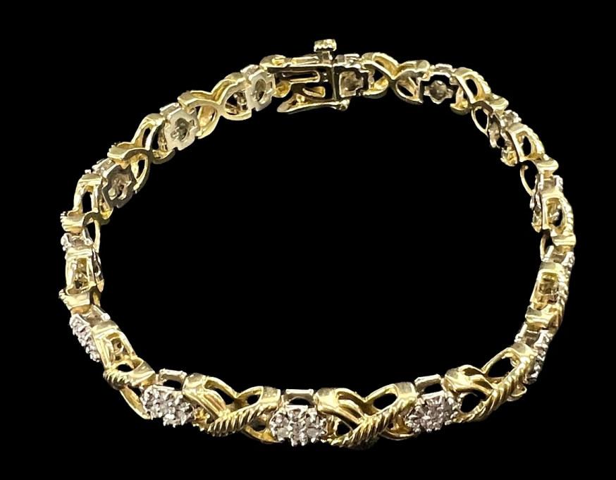 14K Gold Diamond Tennis Bracelet: Total weight: 15.4g. Length: 7". One stone is missing. Please see photos for details.