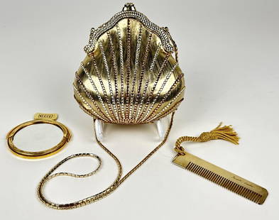 Judith Leiber Chatelaine Rhinestone Handbag: Designed 1967 Brushed gold with silver rhinestone crystals and lined in silver kid skin leather; designed to resemble a snap-top fabric sac. NOTE: Some rhinestones missing as photographed. Length of