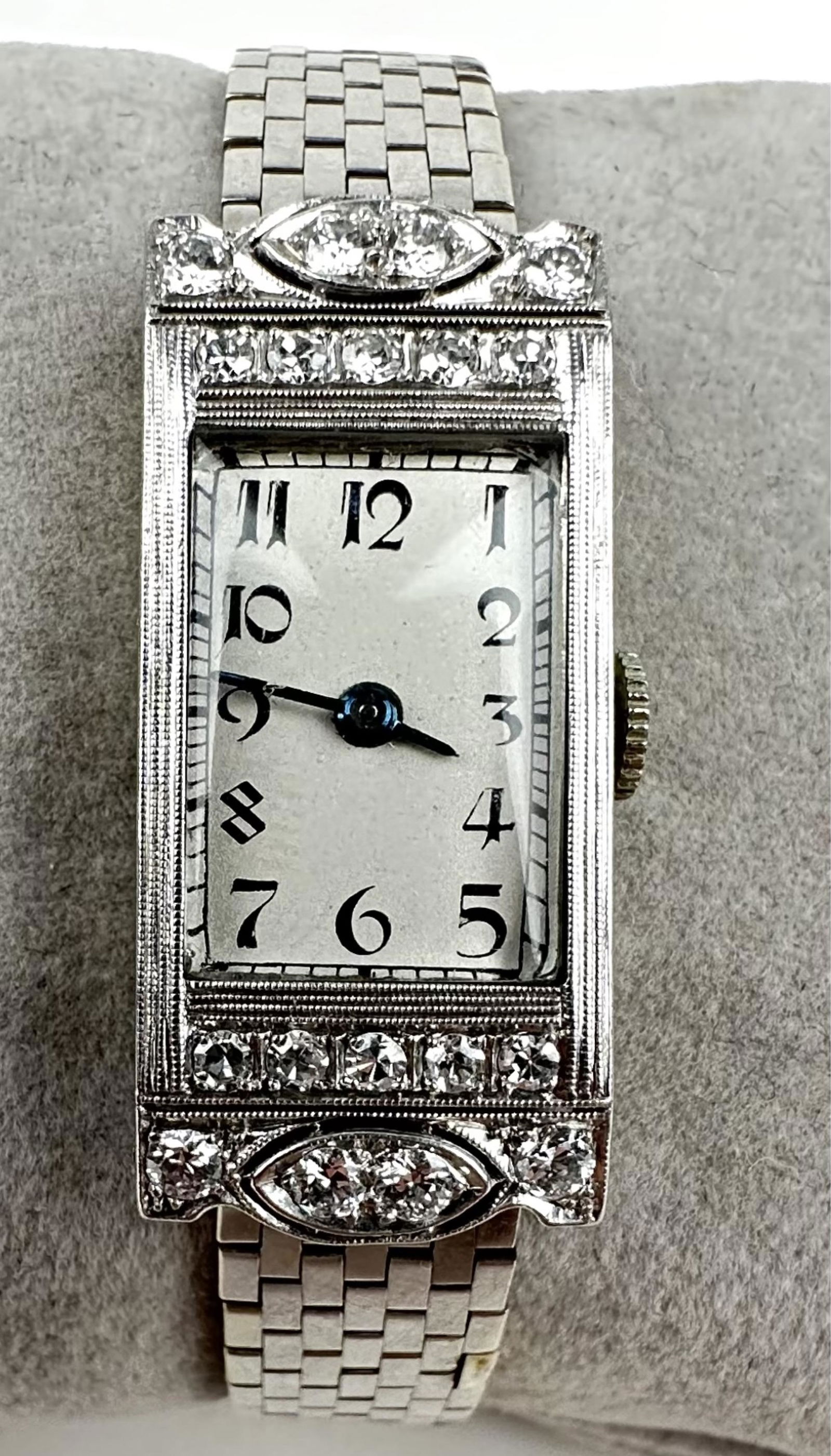 18K White Gold & Diamond Ladies Concord Watch: With 14k white gold band. Art Deco style with 18 diamonds set in the bezel. Total weight: 34.6g Watch is running and in good condition. Not tested for accuracy.