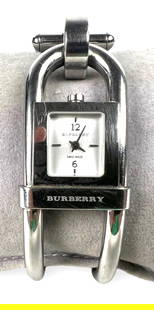Ladies Burberry Watch: Watch needs new battery. Width of face: .45" Condition: Some light scratches to the stainless steel. Please see photos for details.