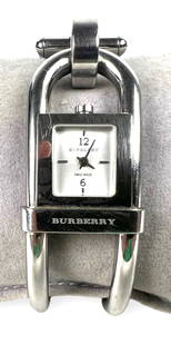 Ladies Burberry Watch: Watch needs new battery. Width of face: .45" Condition: Some light scratches to the stainless steel. Please see photos for details.