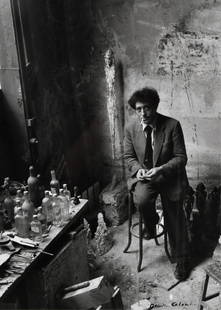Denise Colomb Photograph Alberto Giacometti: Denise Colomb Silver Gelatin of Alberto Giacometti in studio, signed lower right in ink, Denise Colomb, with a Marcel Pelletier label on reverse. Image 15" x 10.75" Frame 21.25" x 17" Condition: Image