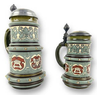 (2) Mettlach "Symbols of the Hanseatic League": Beer Steins .5 Liter- 9" Tall & .25 Liter- 7" Tall Condition: Steins are in very good condition with no signs of damage or wear.