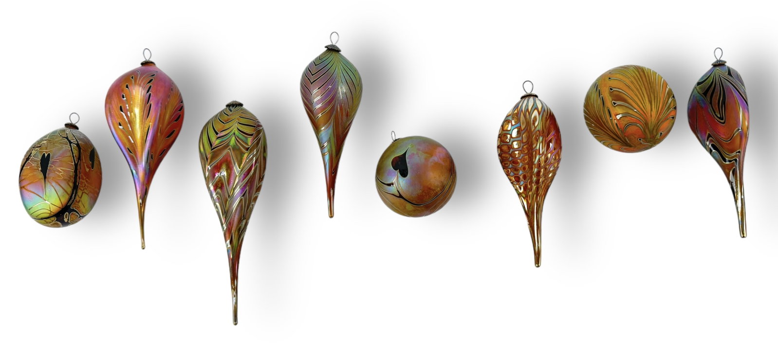 (8) Craig Zweifel Art Glass Ornaments: Size: Largest ornament is 6" long 1 3/4" wide Condition: Very Good. No chips or cracks.