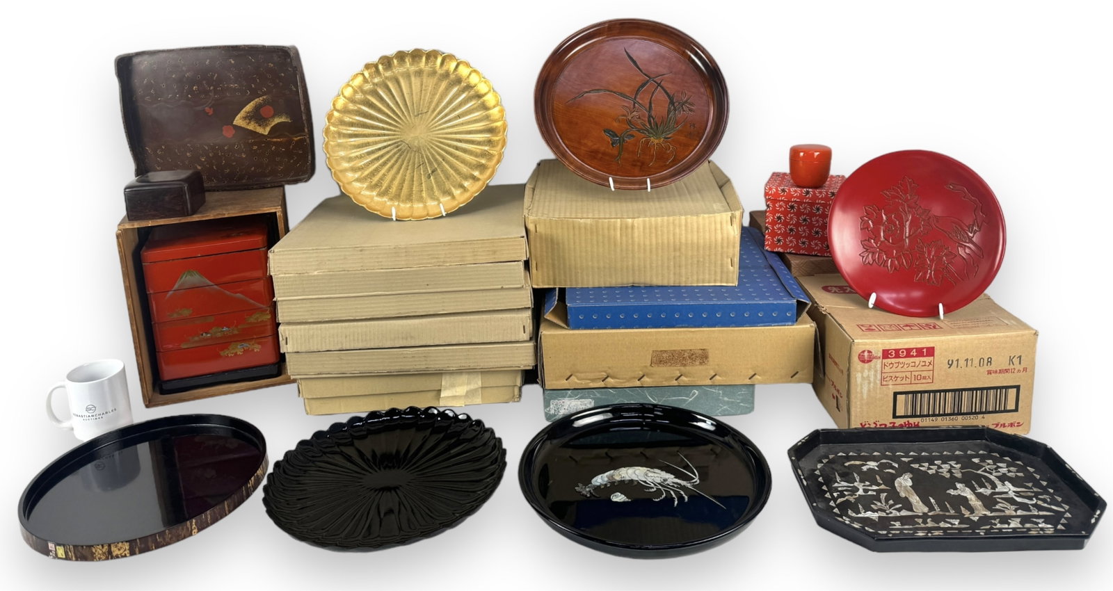 Lg. Lot of Plates & Chargers in Wood & Lacquer: Size of gold plate in back: 12 1/2" across Variety of plates, trays, and chargers, with a majority being the gold plate pictured. Also pictured: a small lidded wood box and a lacquer stacking box. Eac